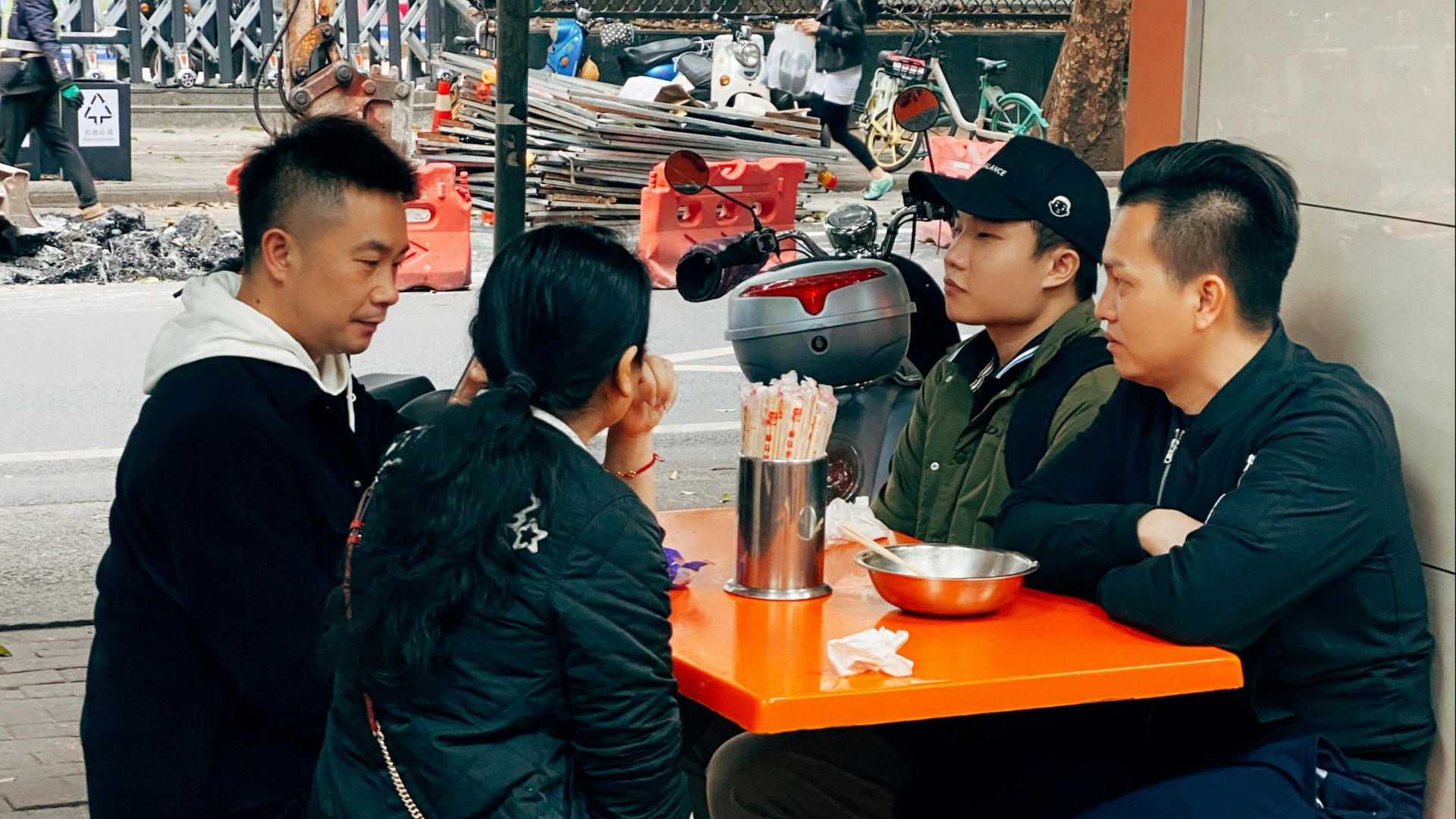 man in black jacket sitting beside woman in black jacket