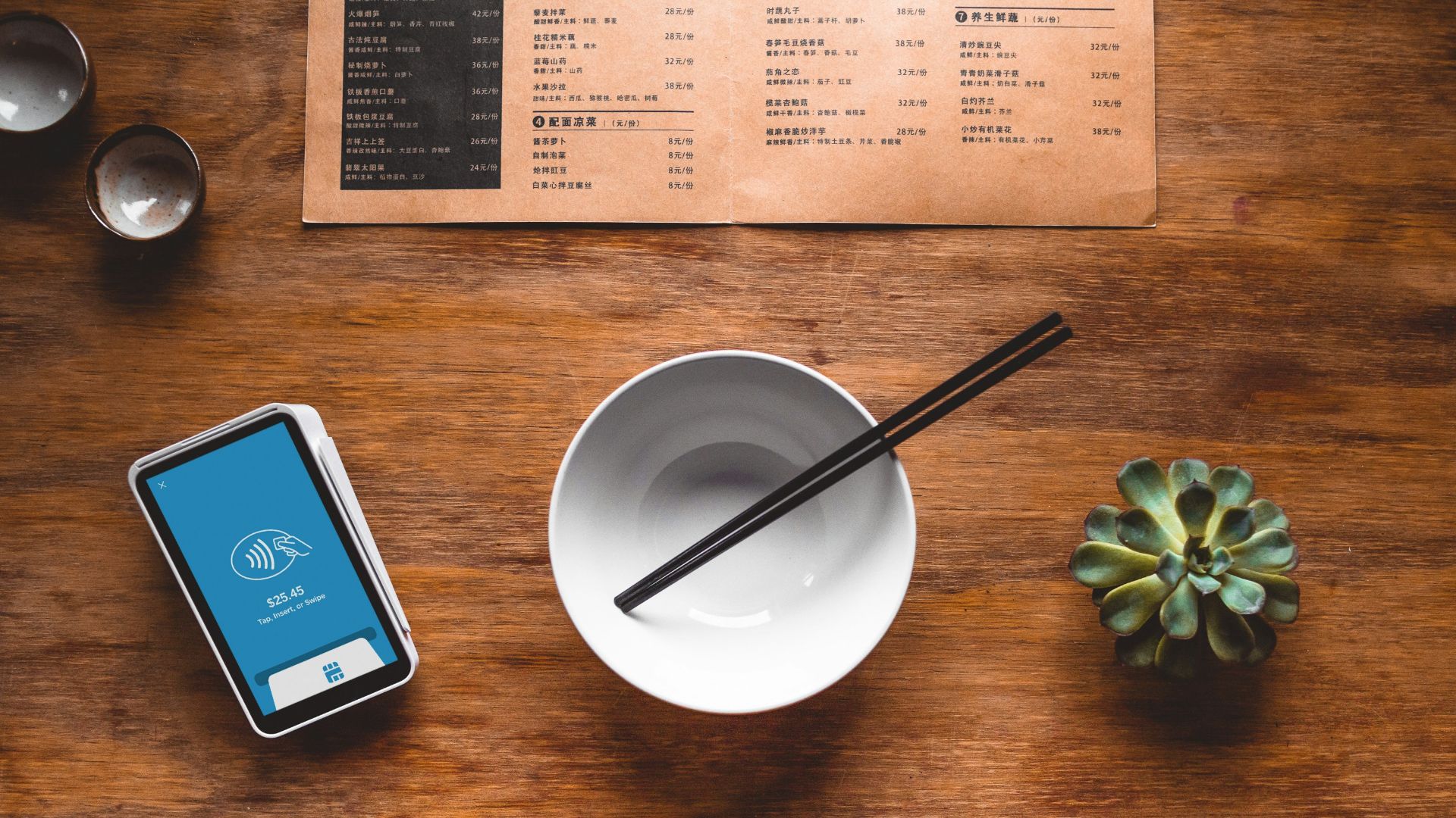black chopsticks in white ceramic bowl on table