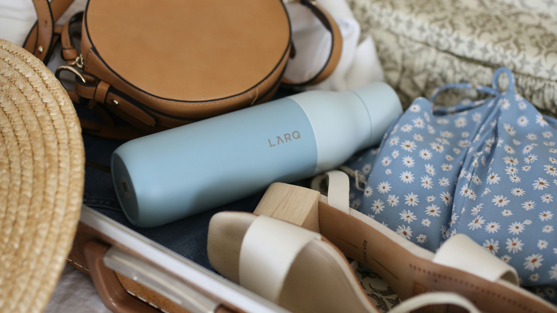 brown and gray leather suitcase