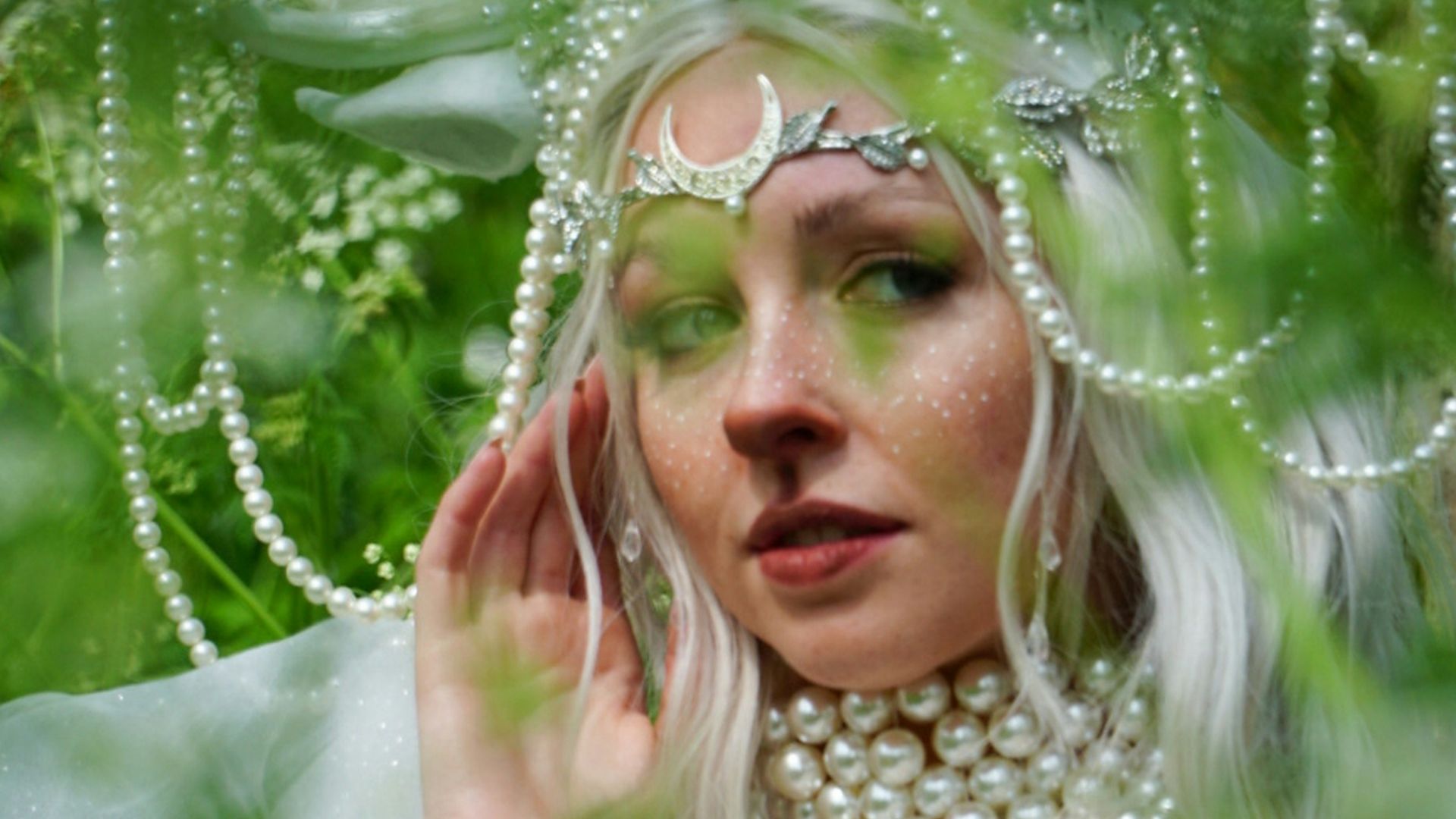 a woman with white hair wearing a costume