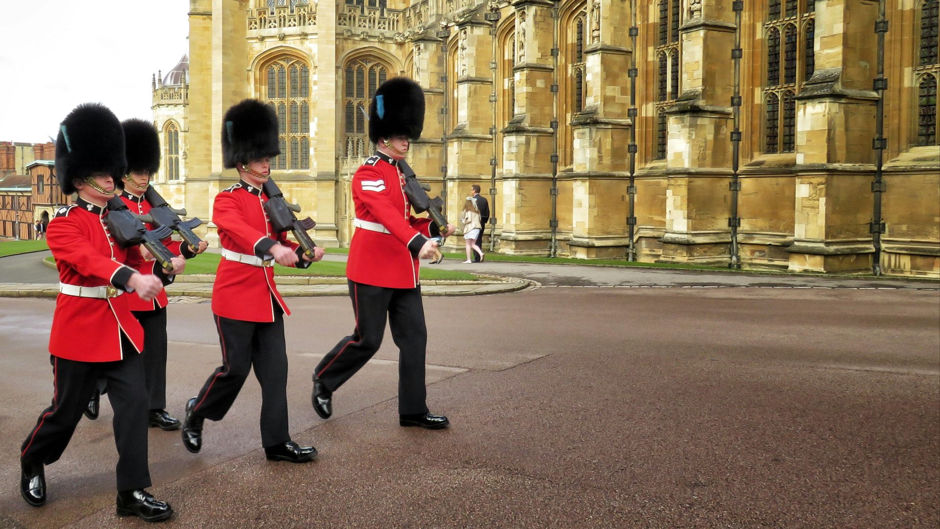 four Royal Guards marching outside palace