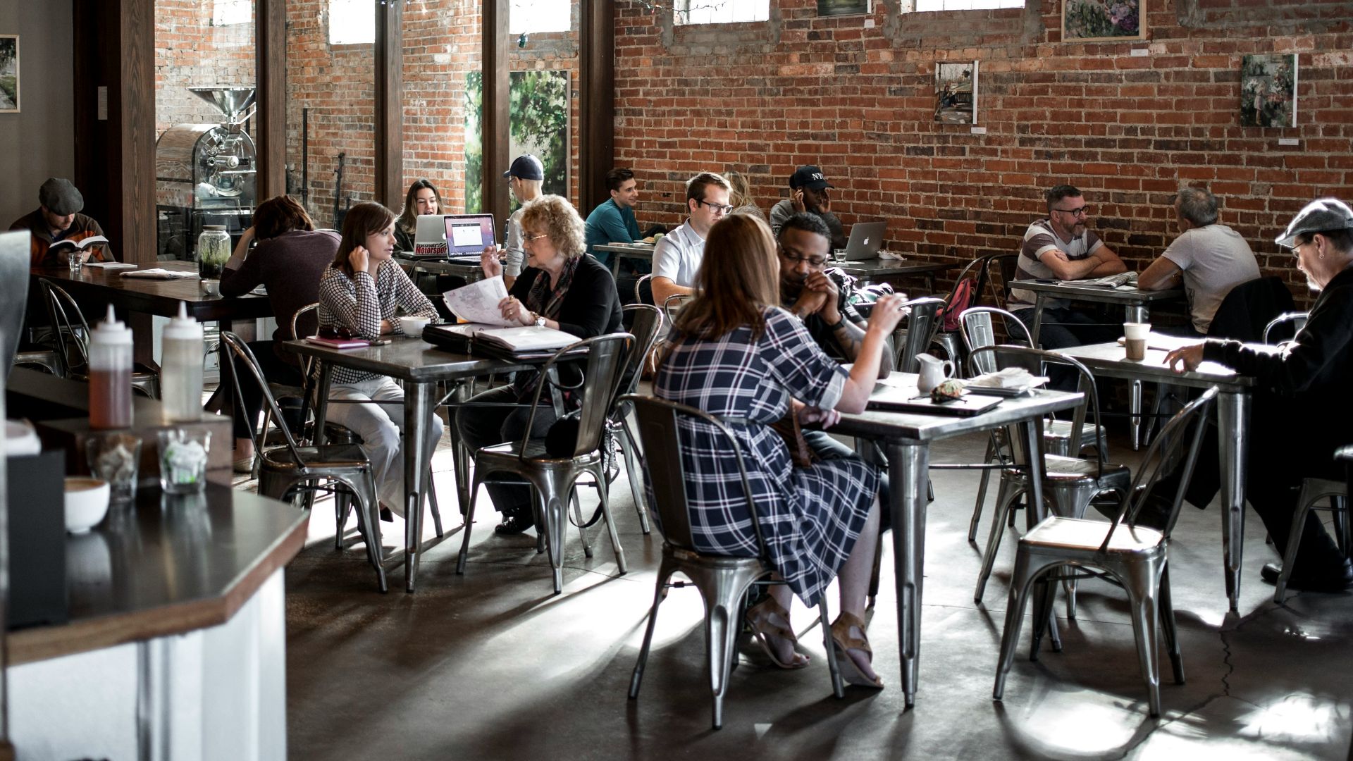 people sitting on restaurant chairs
