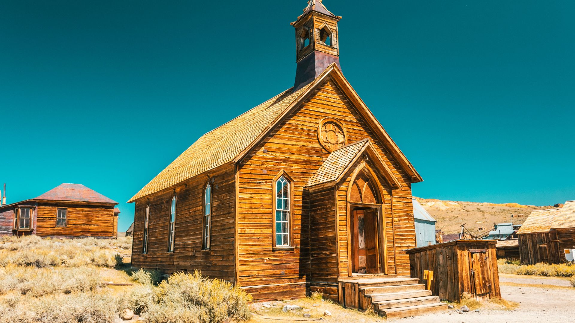 brown and gray concrete church under blue sky during daytime