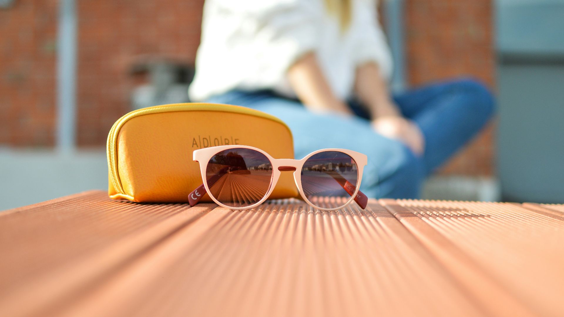 sunglasses beside a purse