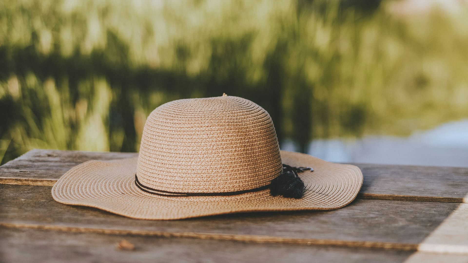 brown fedora hat on brown wooden table