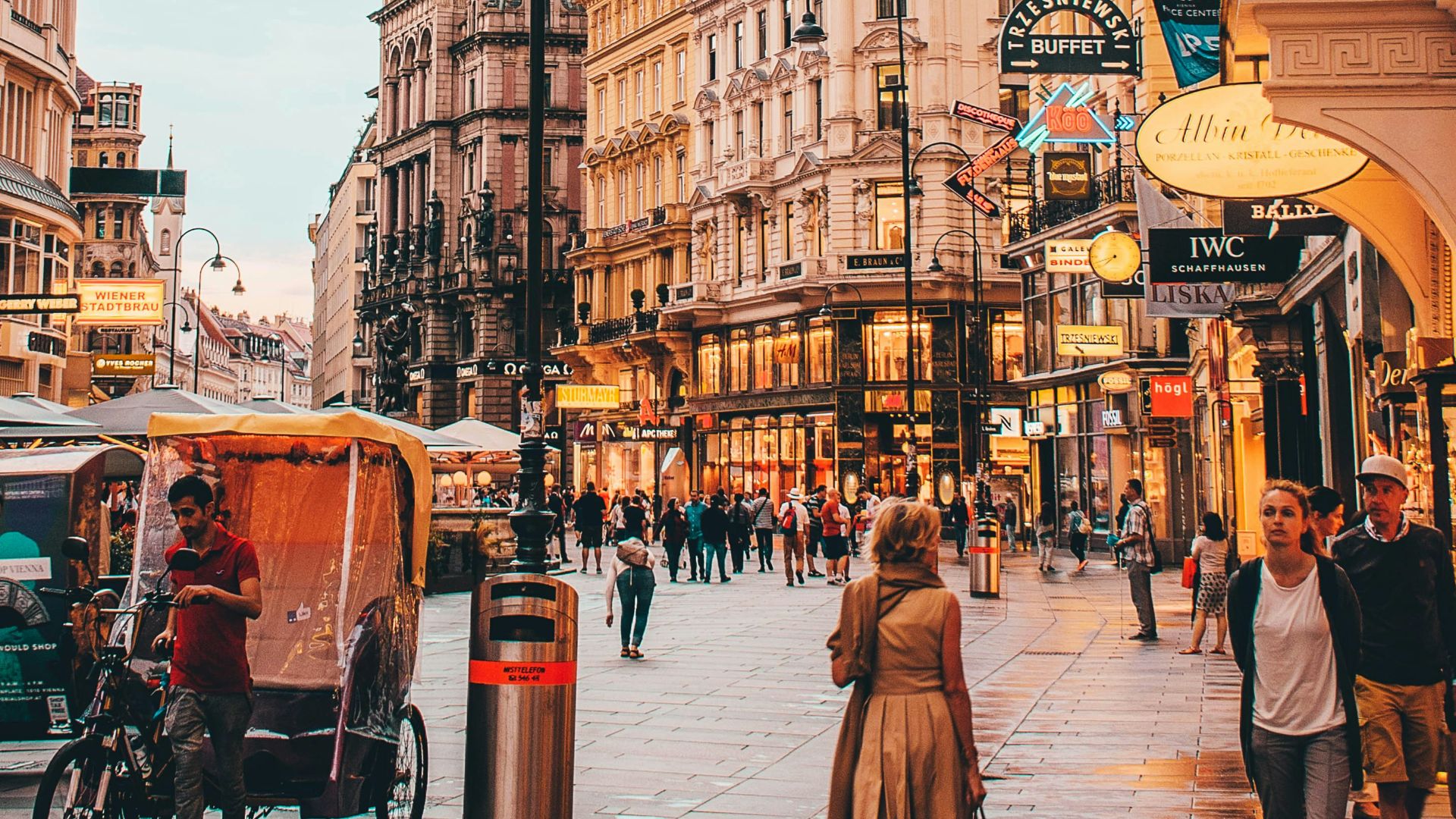 people walking beside Berlitz building during daytime