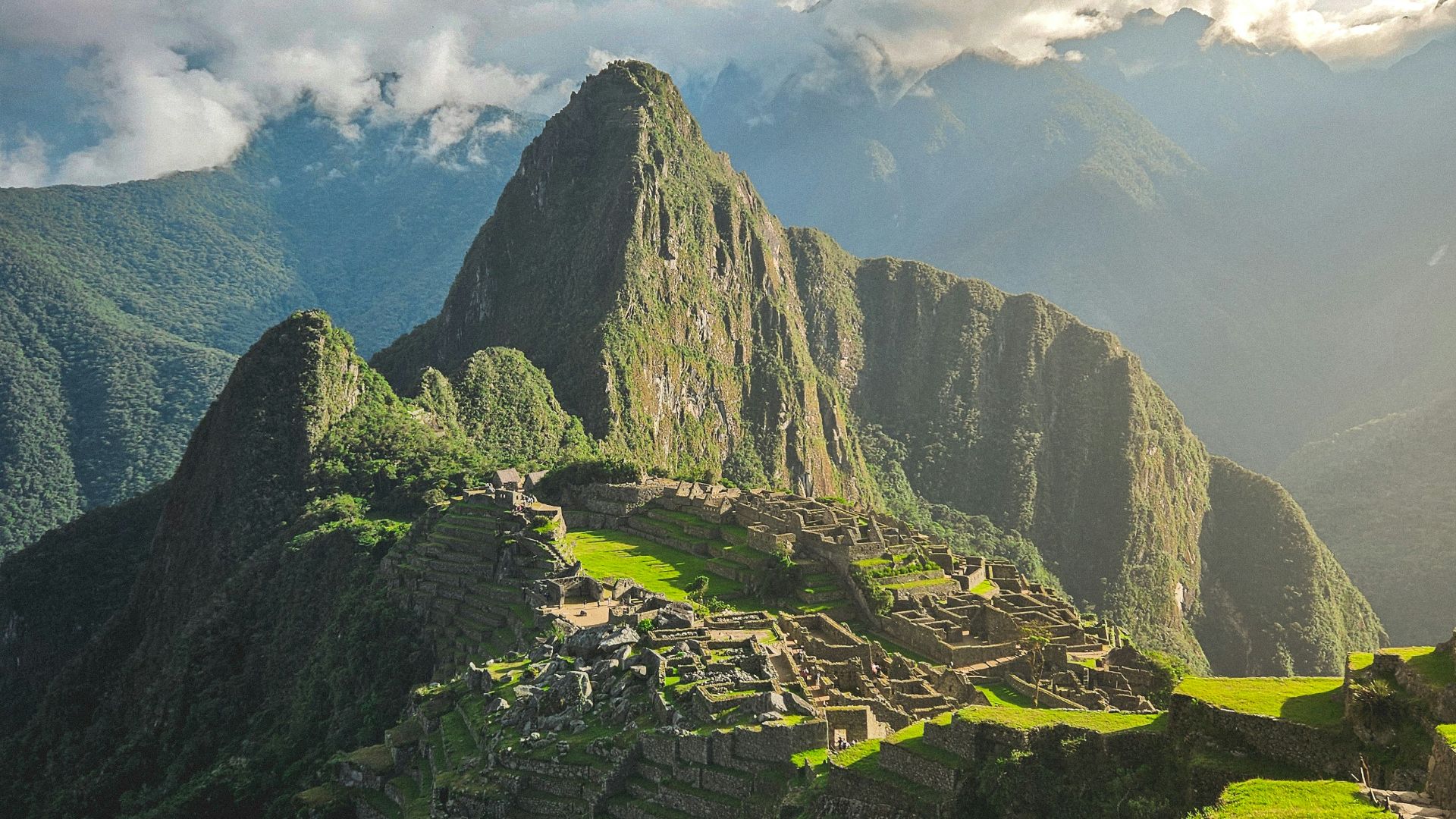 A scenic view of a mountain range in the mountains