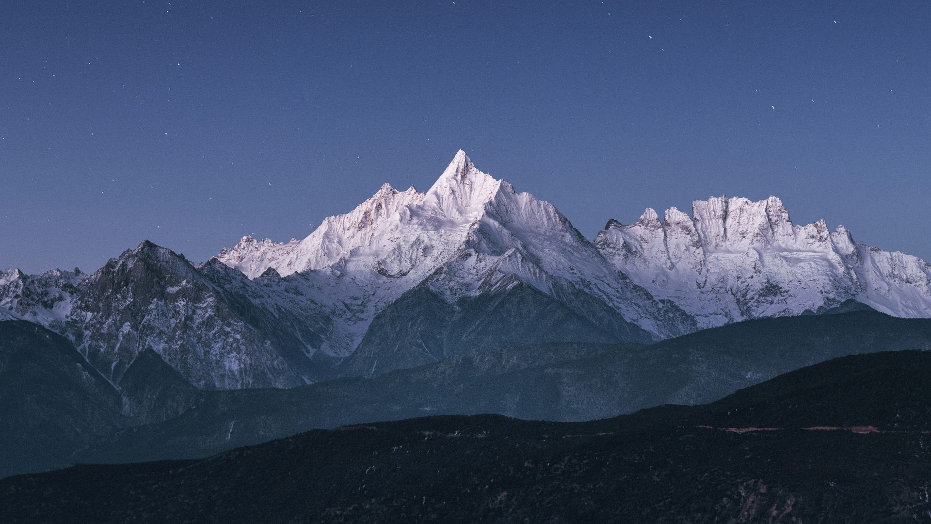 snow covered mountain under blue sky during daytime