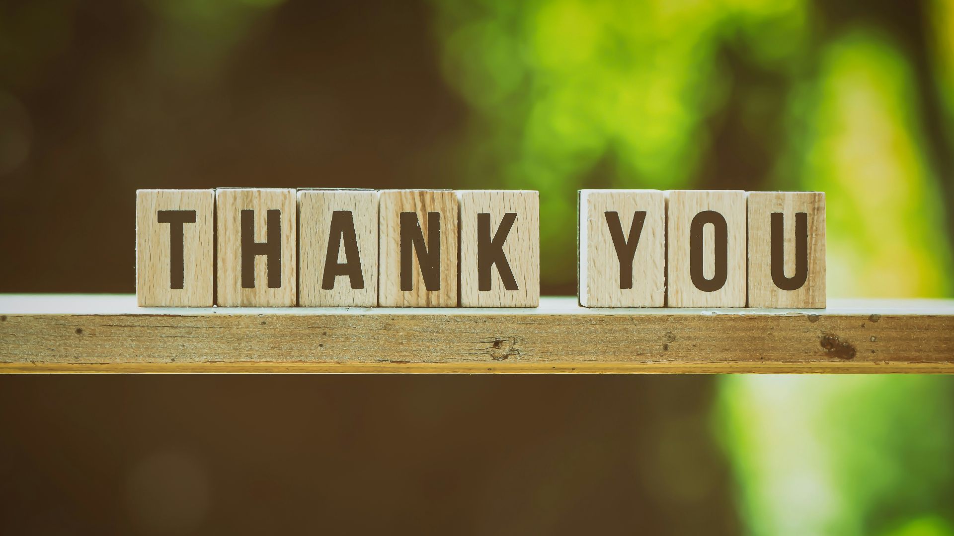 brown and white wooden arrow sign