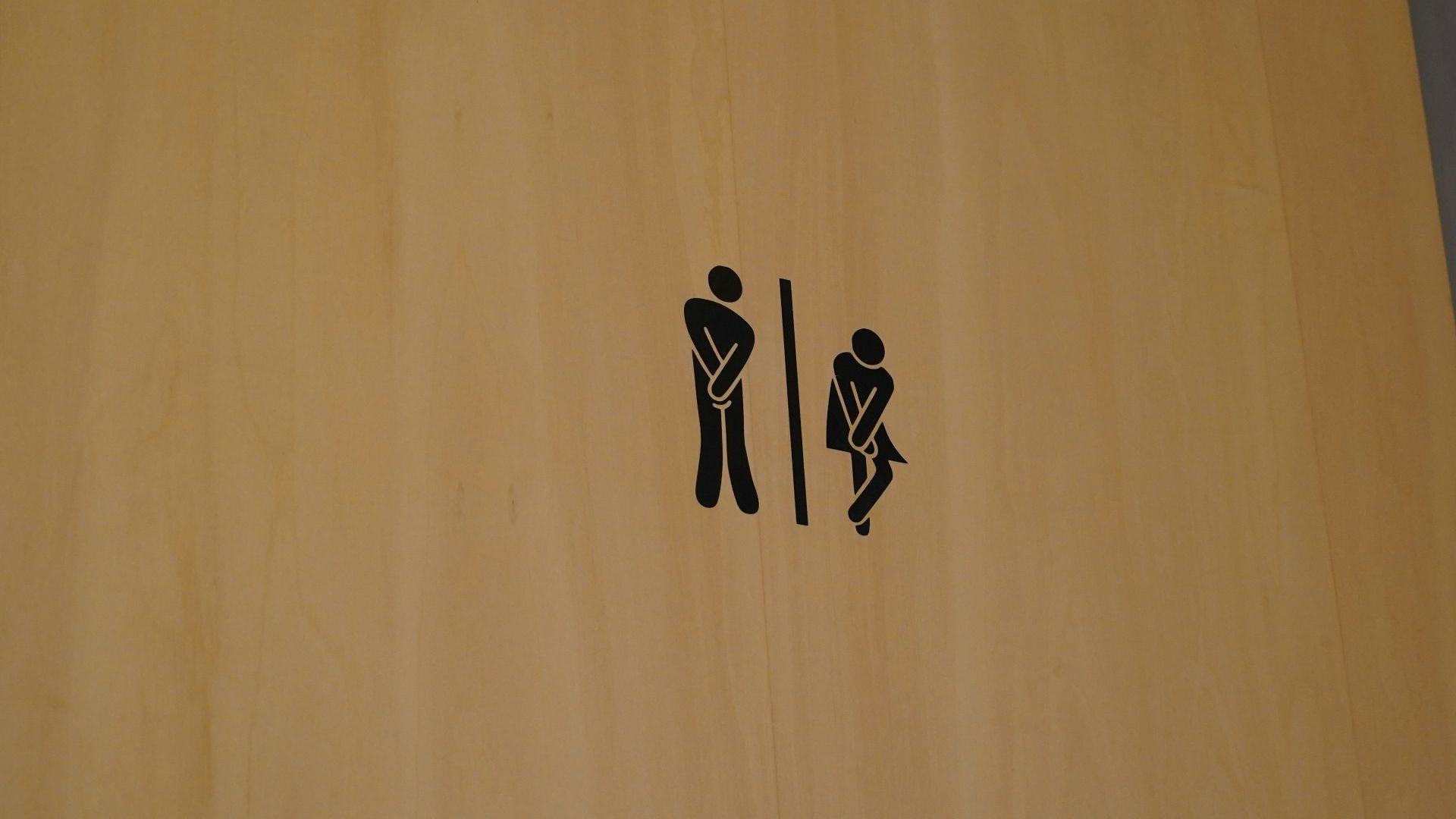 a wood door with black text on it