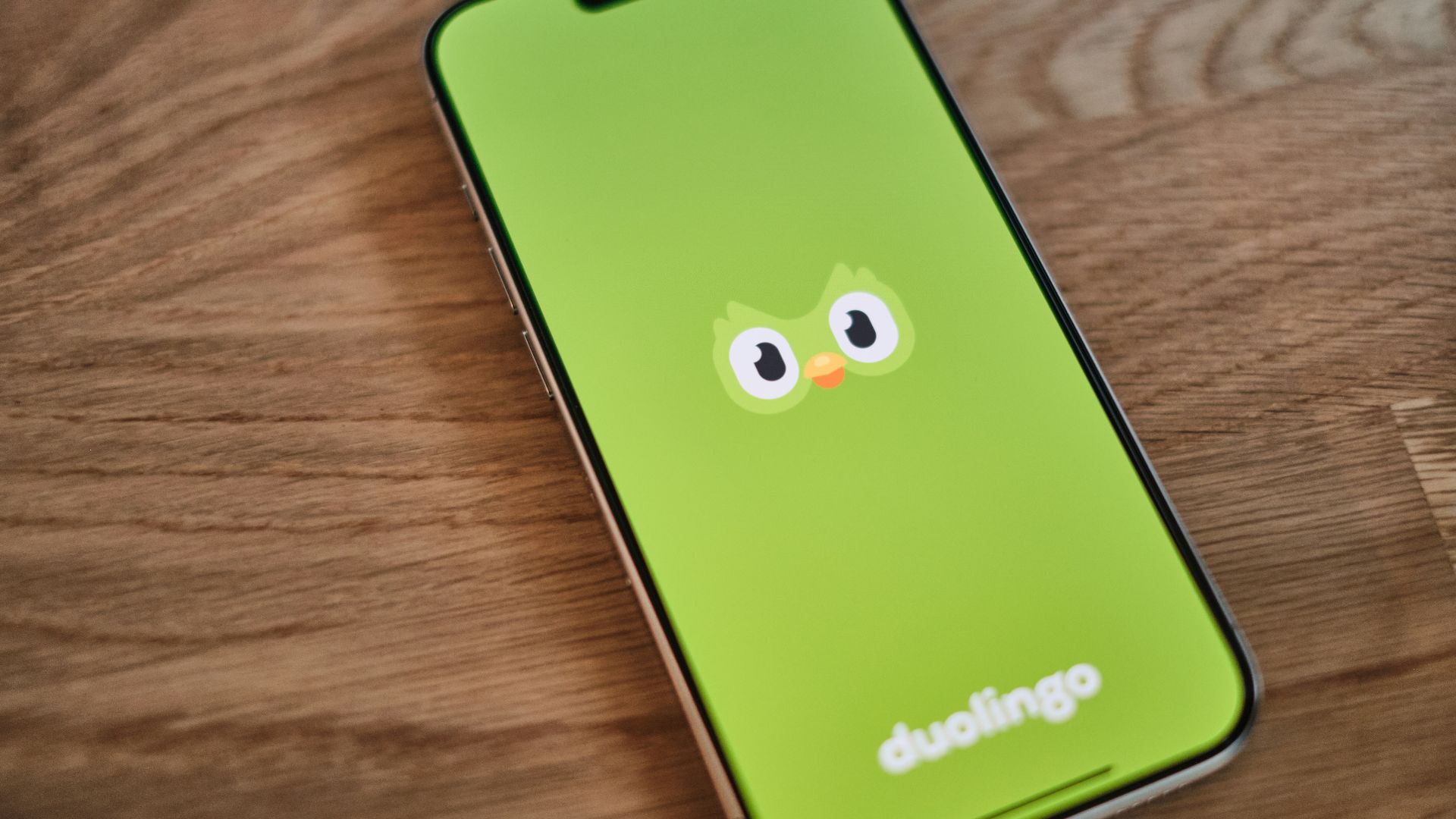 A green phone with a face drawn on it
