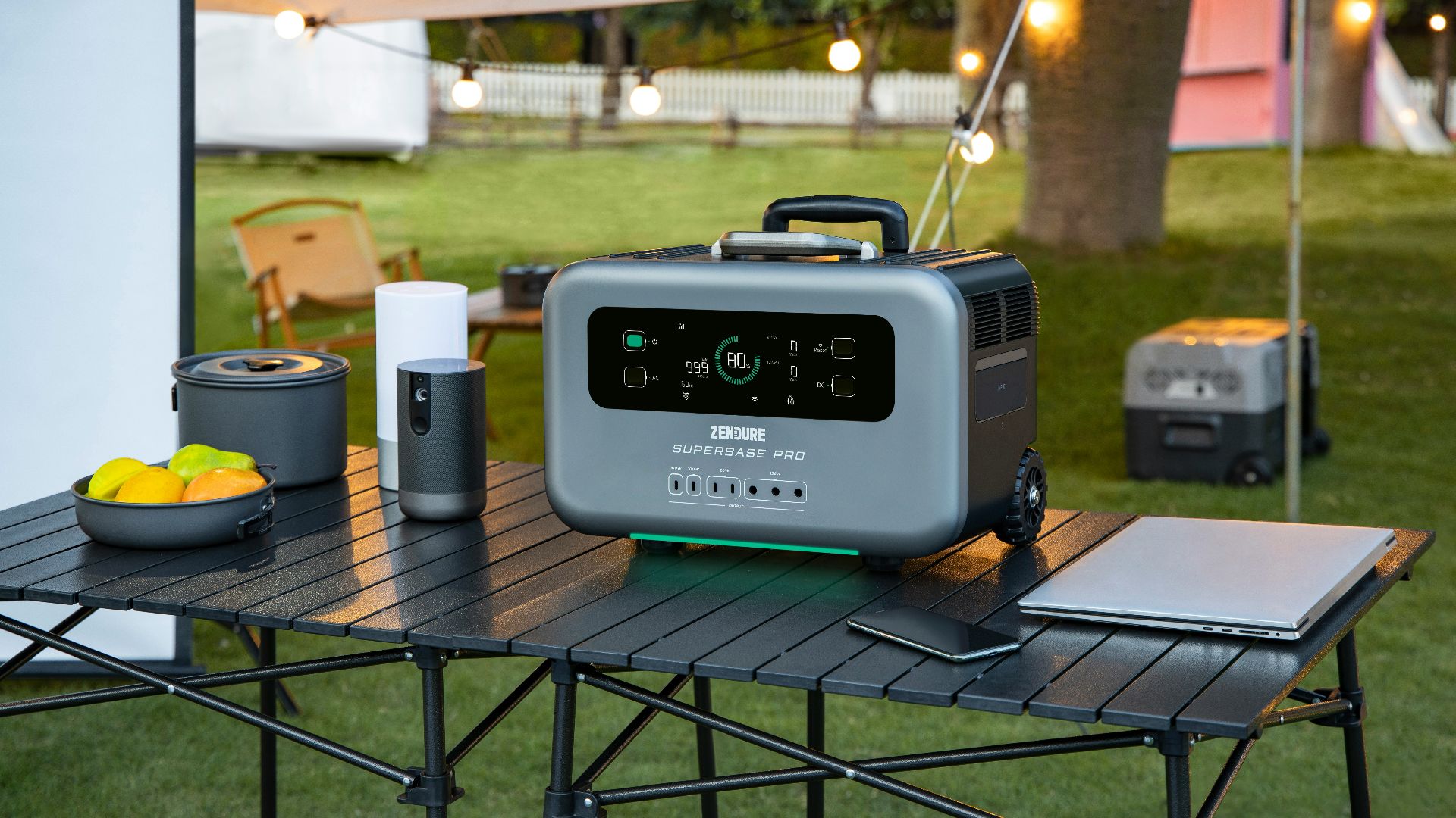 a table with a cooler and a laptop on it