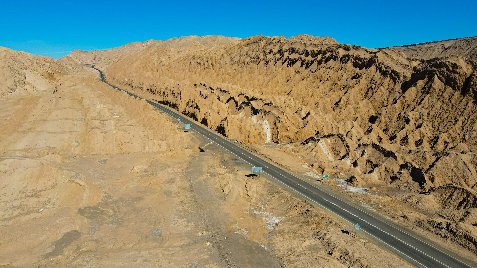 a long road in the middle of a desert