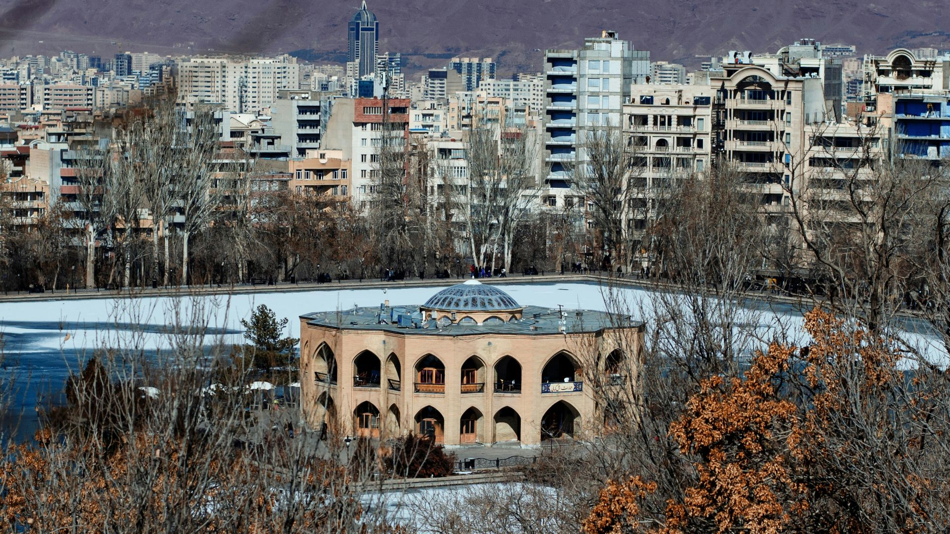 a view of a city with mountains in the background