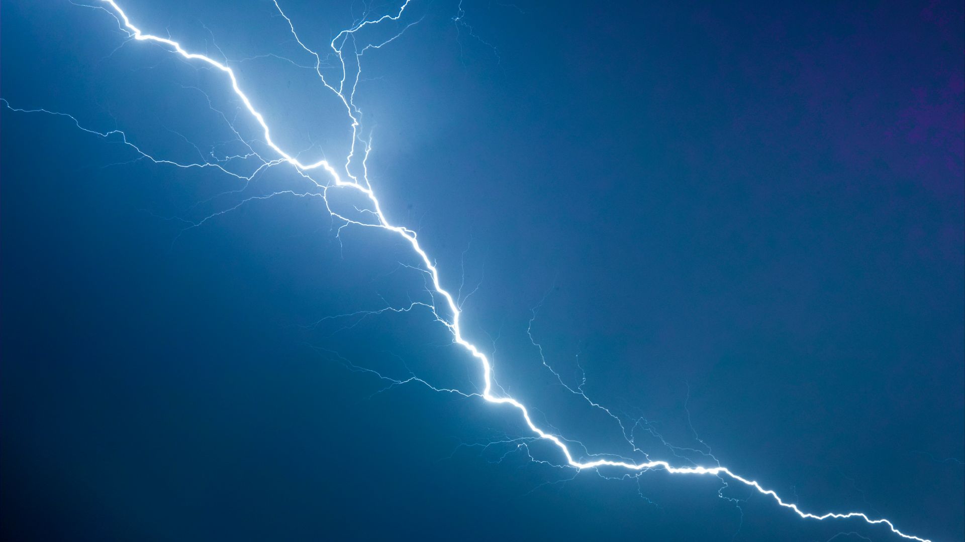a lightning bolt is seen in the sky