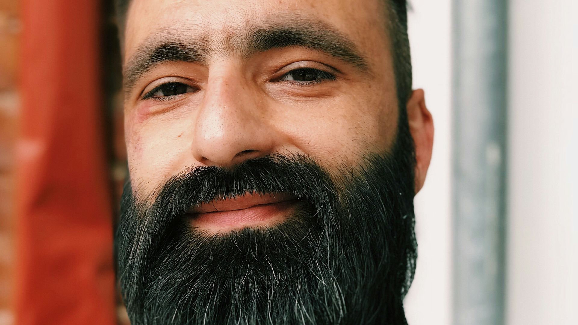 bearded man taking a selfie