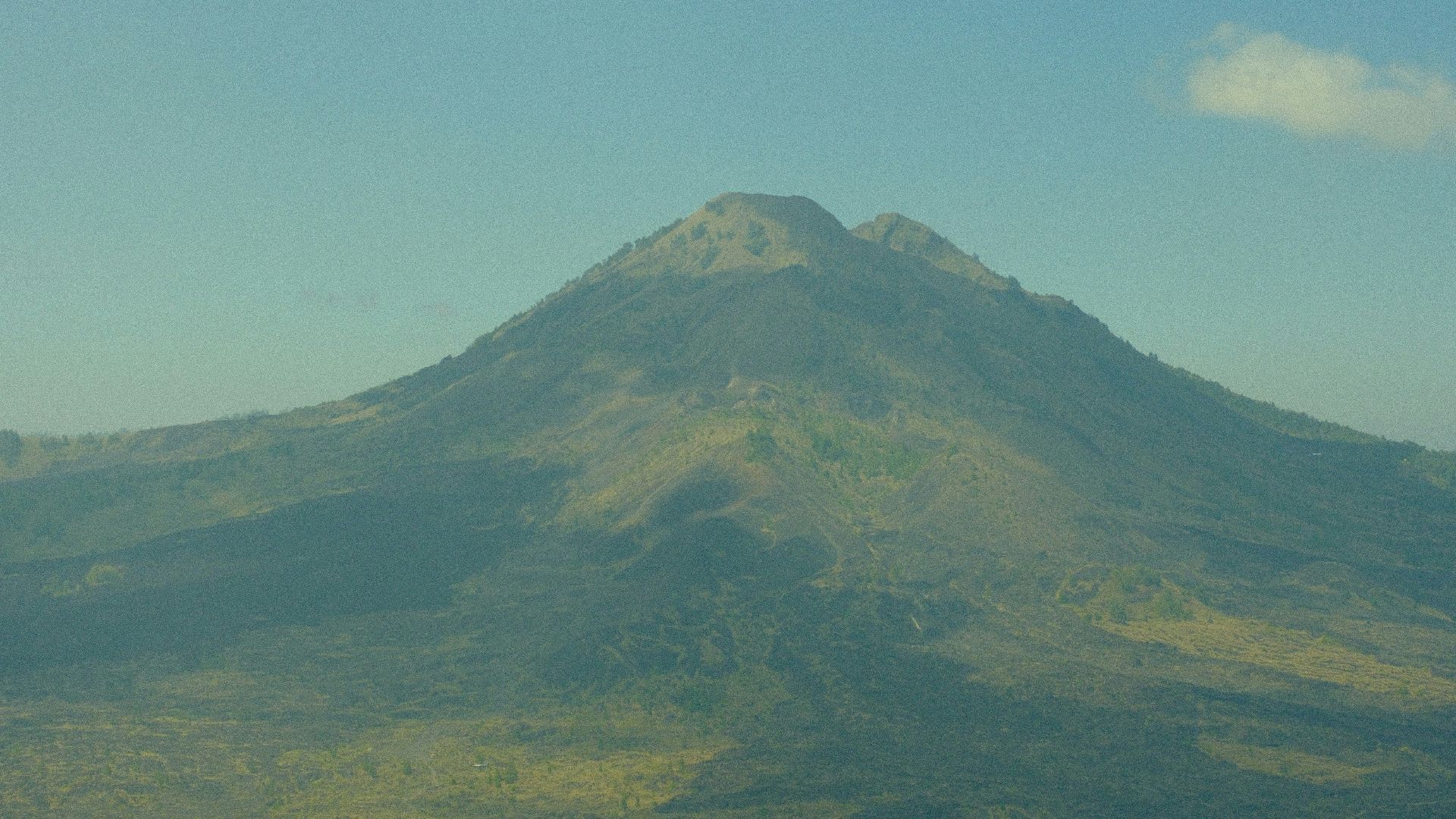 a view of a mountain from a distance
