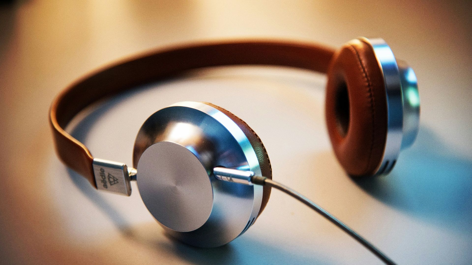 gray and brown corded headphones