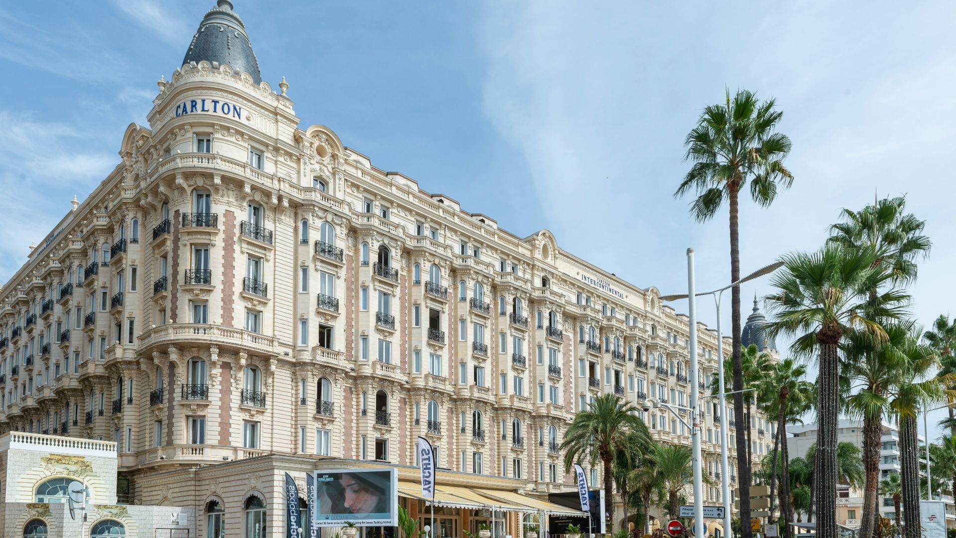 a very tall building sitting on the side of a road
