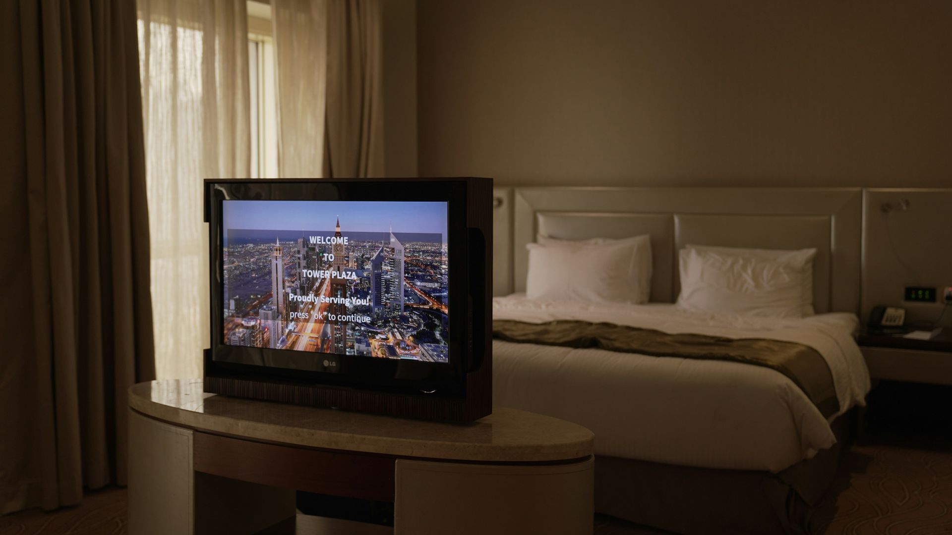 a flat screen tv sitting on top of a table