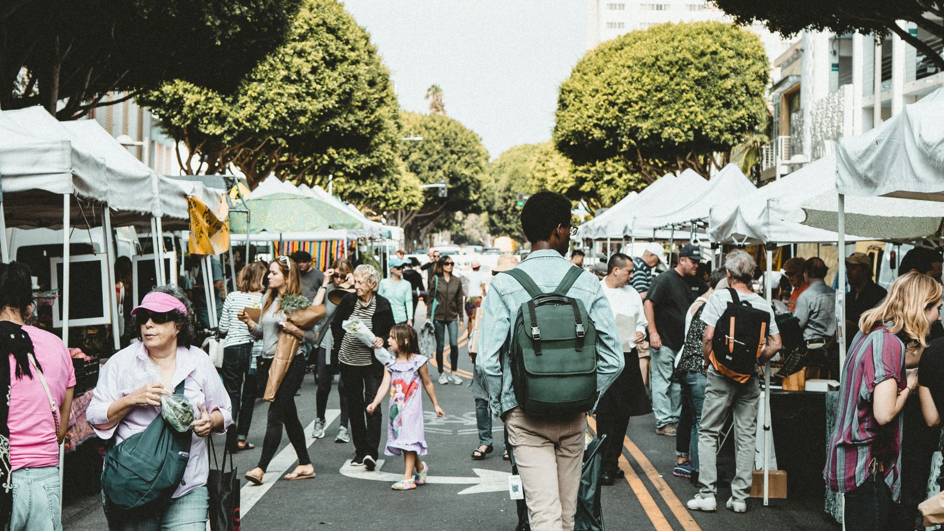 people walking on walkway during daytime