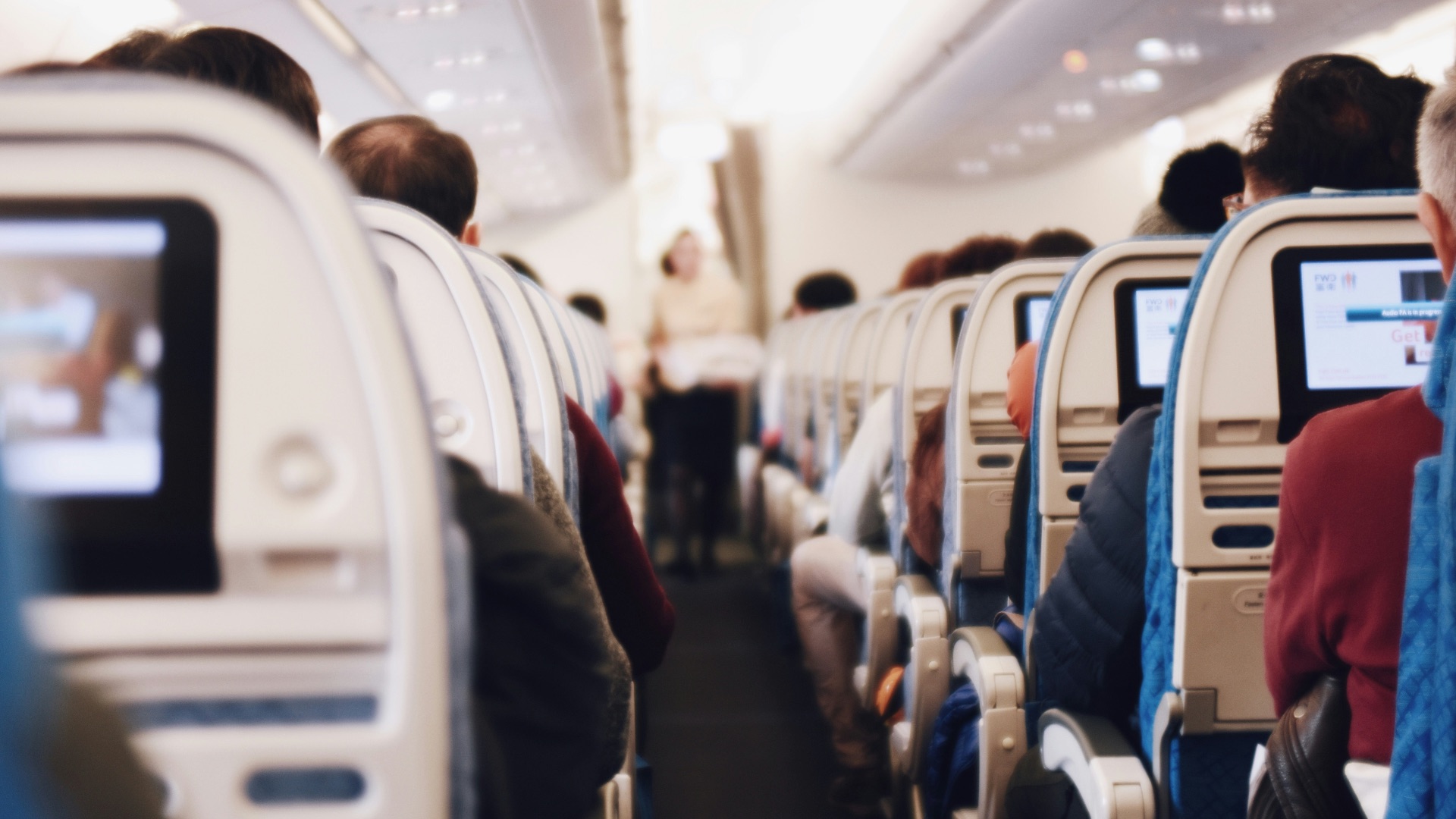 shallow focus photography of people inside of passenger plane