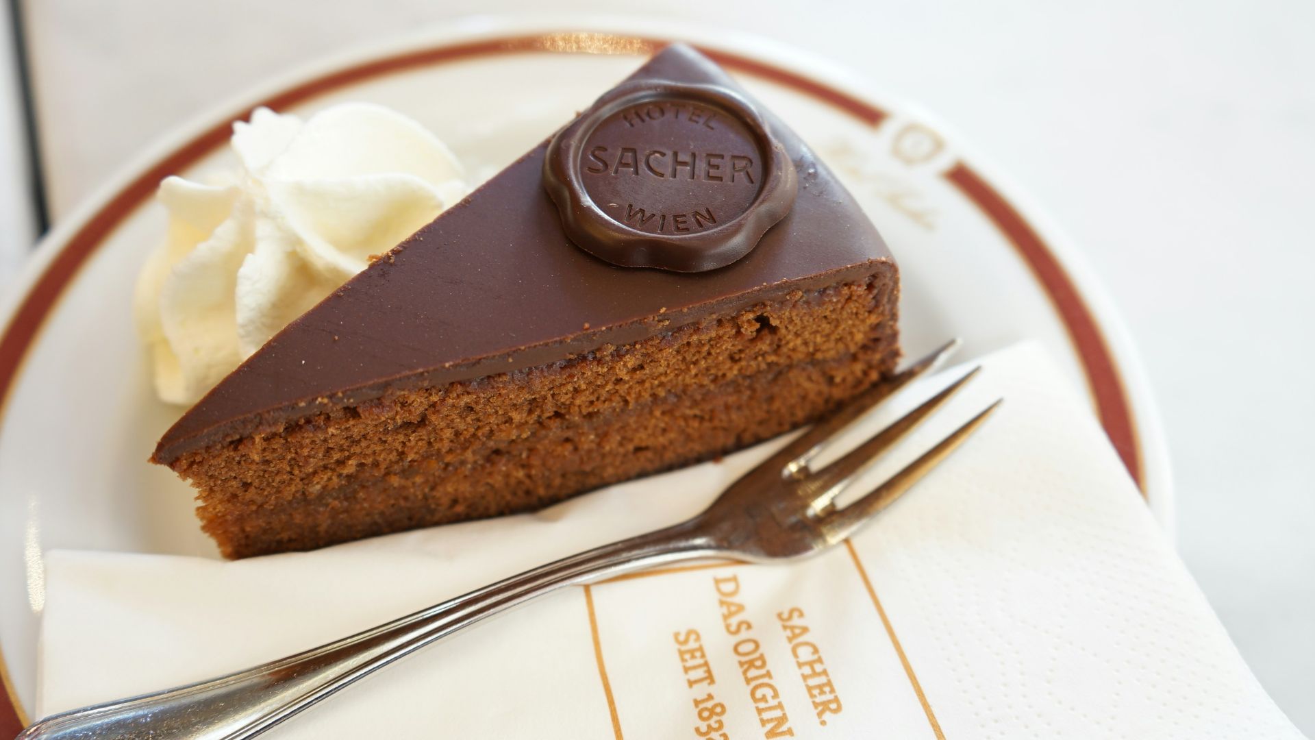 sliced chocolate cake on white ceramic plate