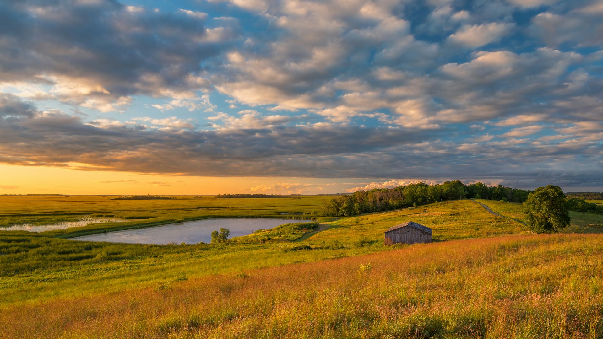 a small house on a grassy hill