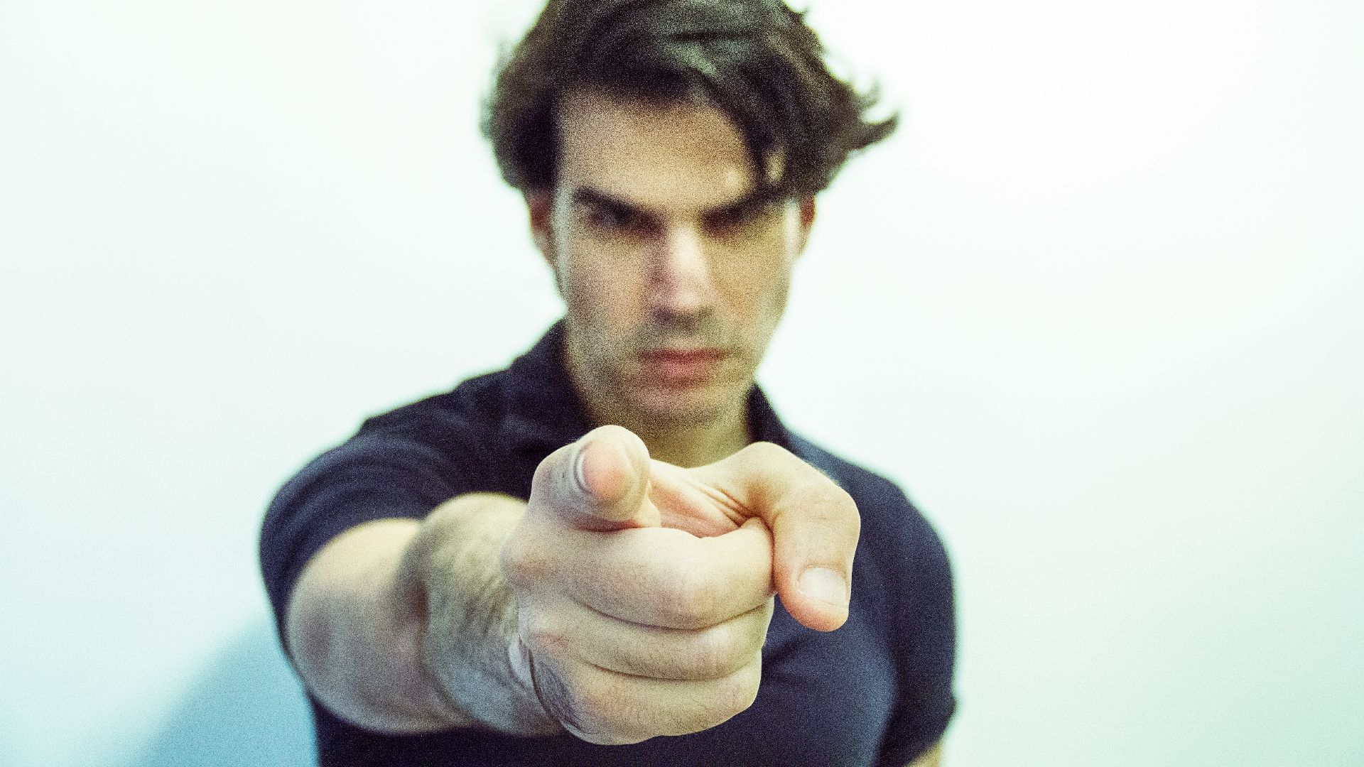 man pointing at camera