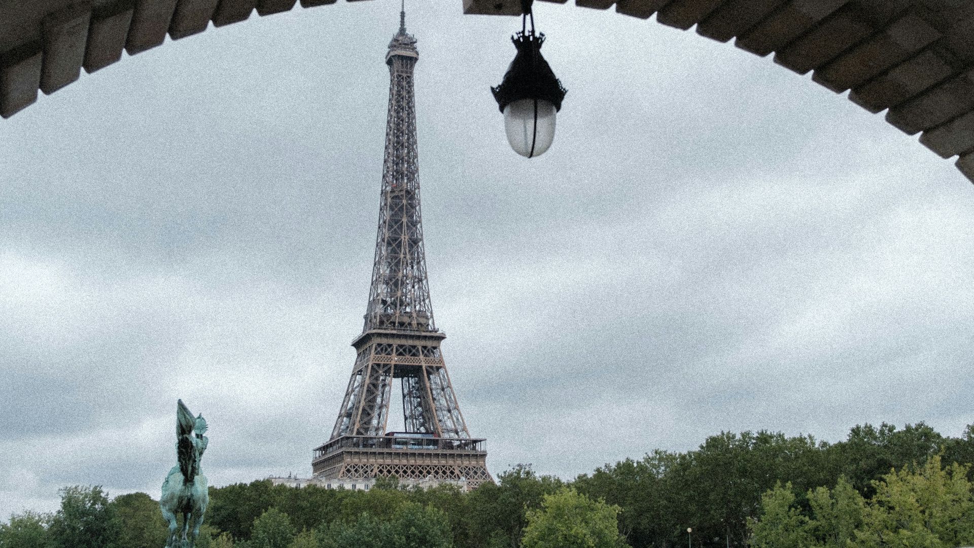 brown concrete building near green trees during daytime