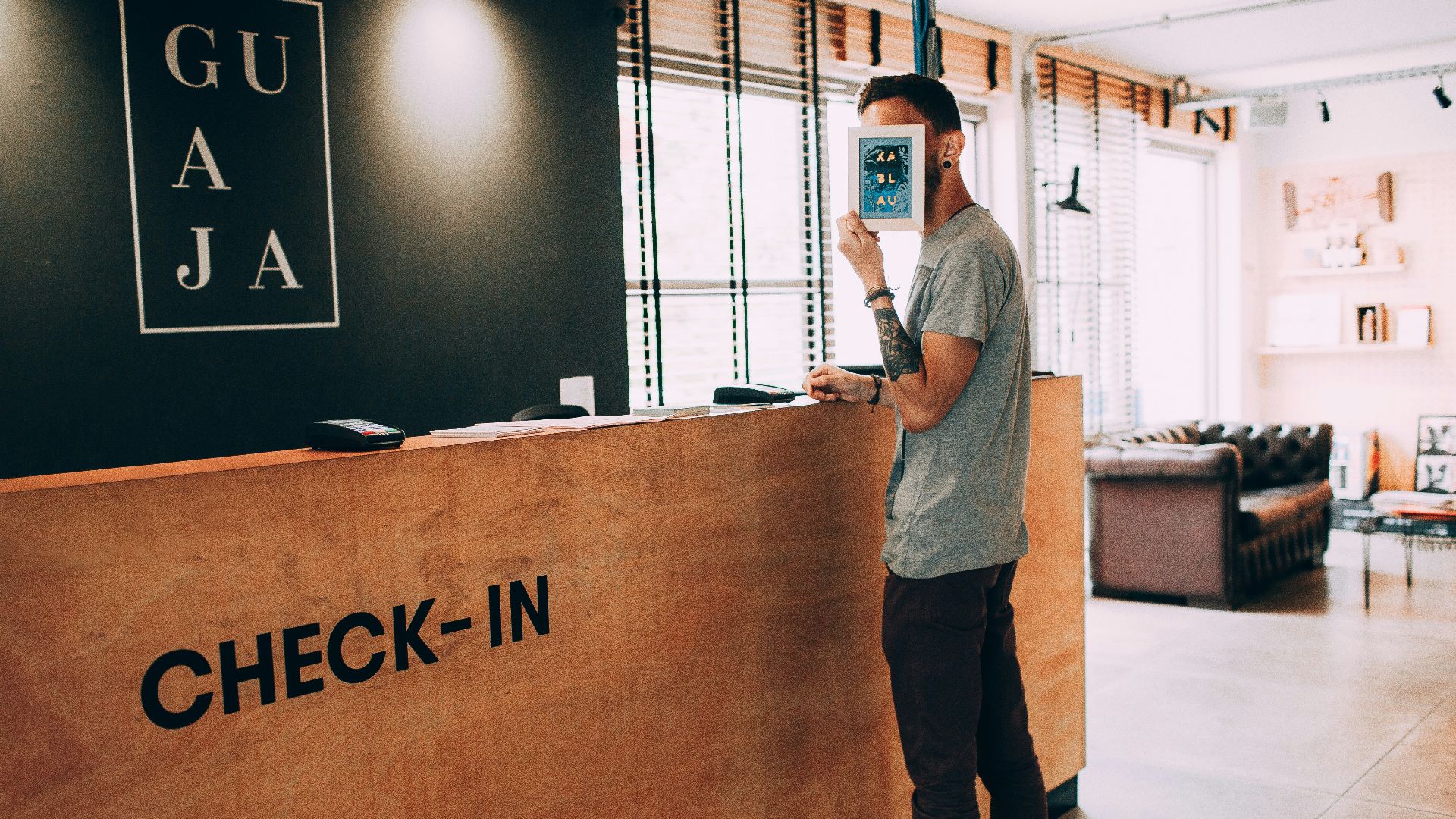 man standing beside counter