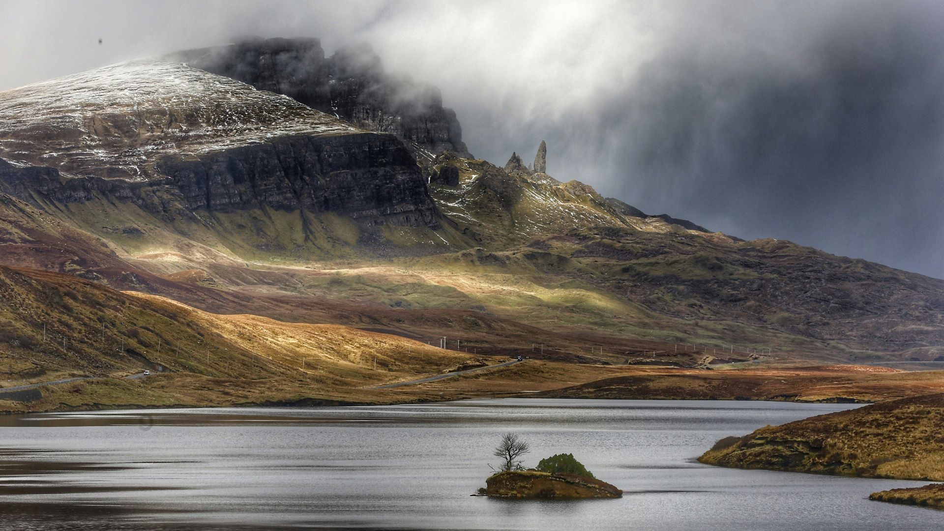 aerial photo of mountain and body of water at daytime