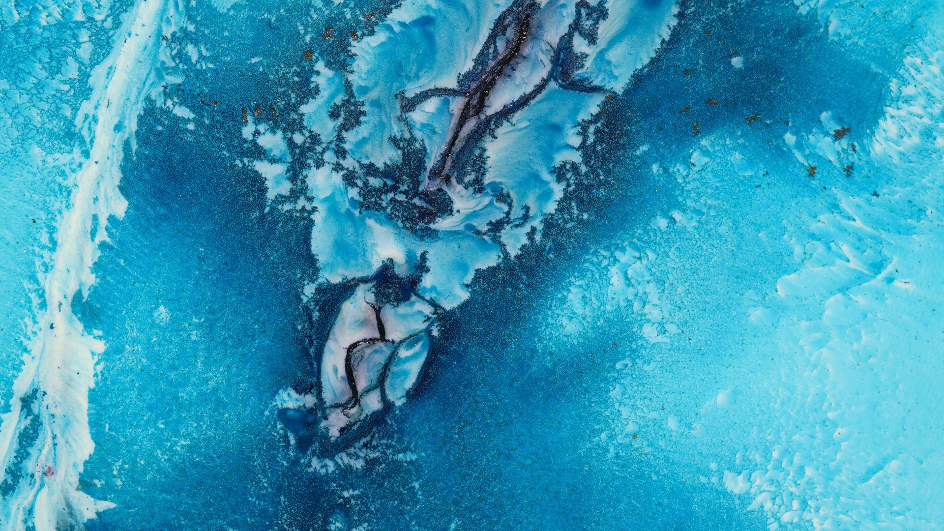 an aerial view of a blue and white substance