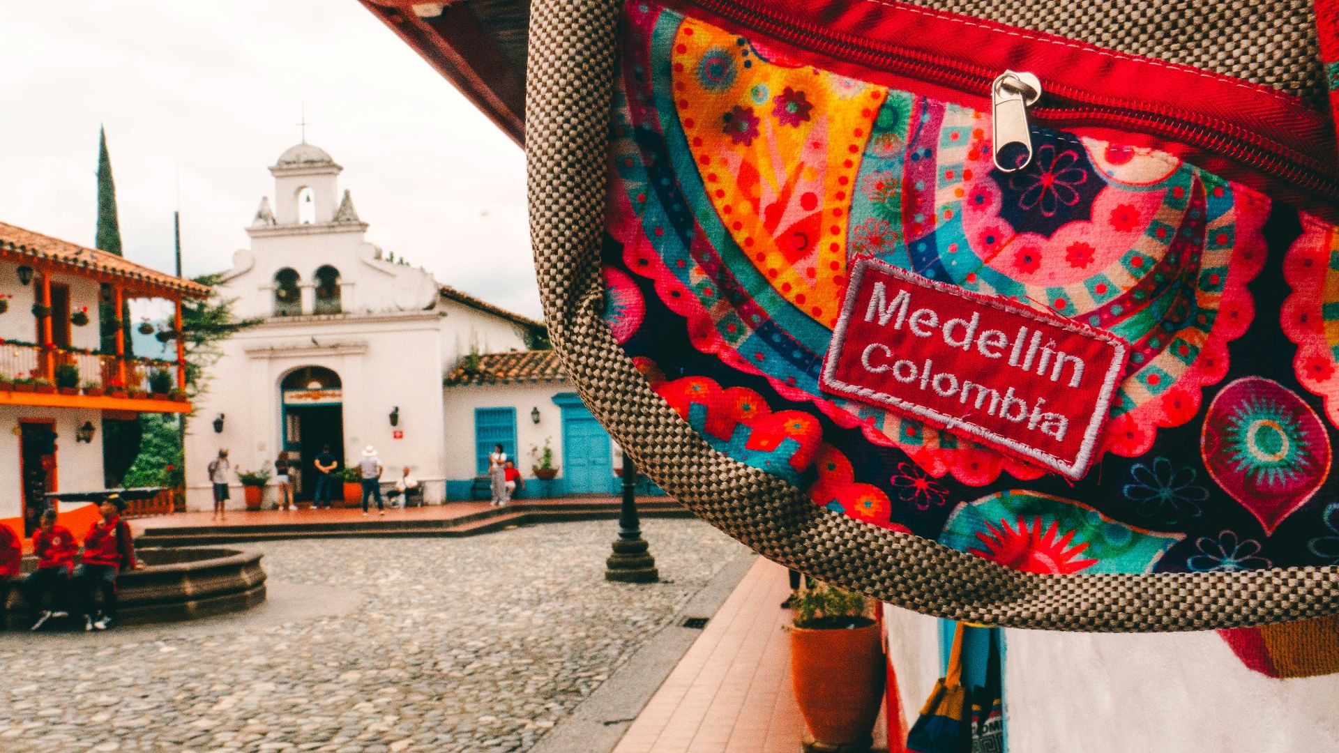 a colorful bag hanging from the side of a building