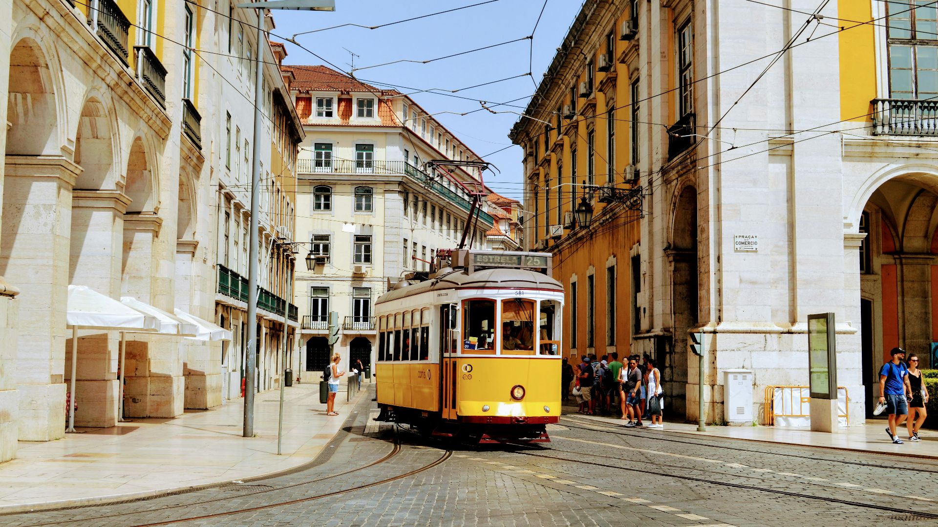 yellow and white tram on road during daytime