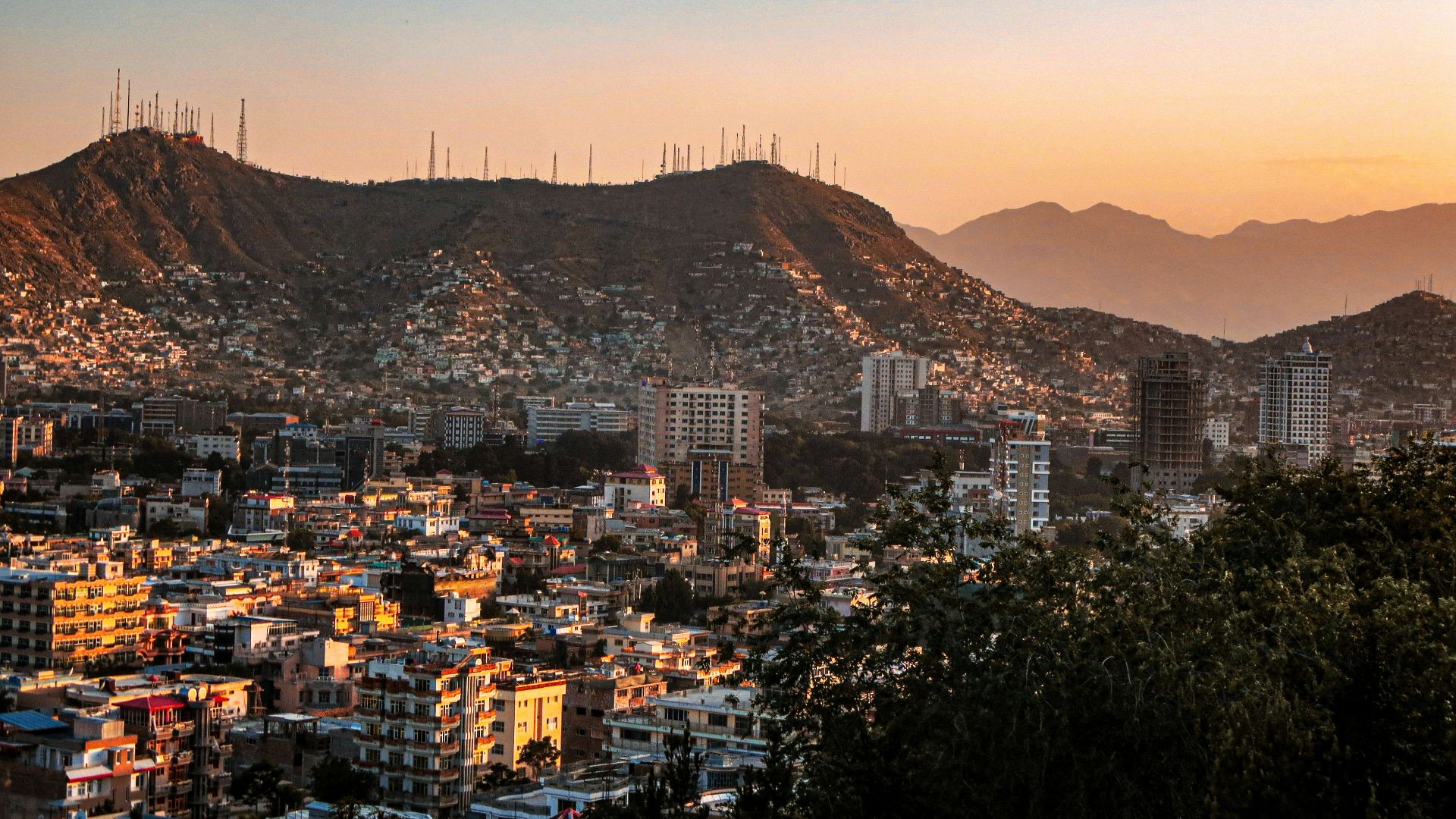 a view of a city with mountains in the background