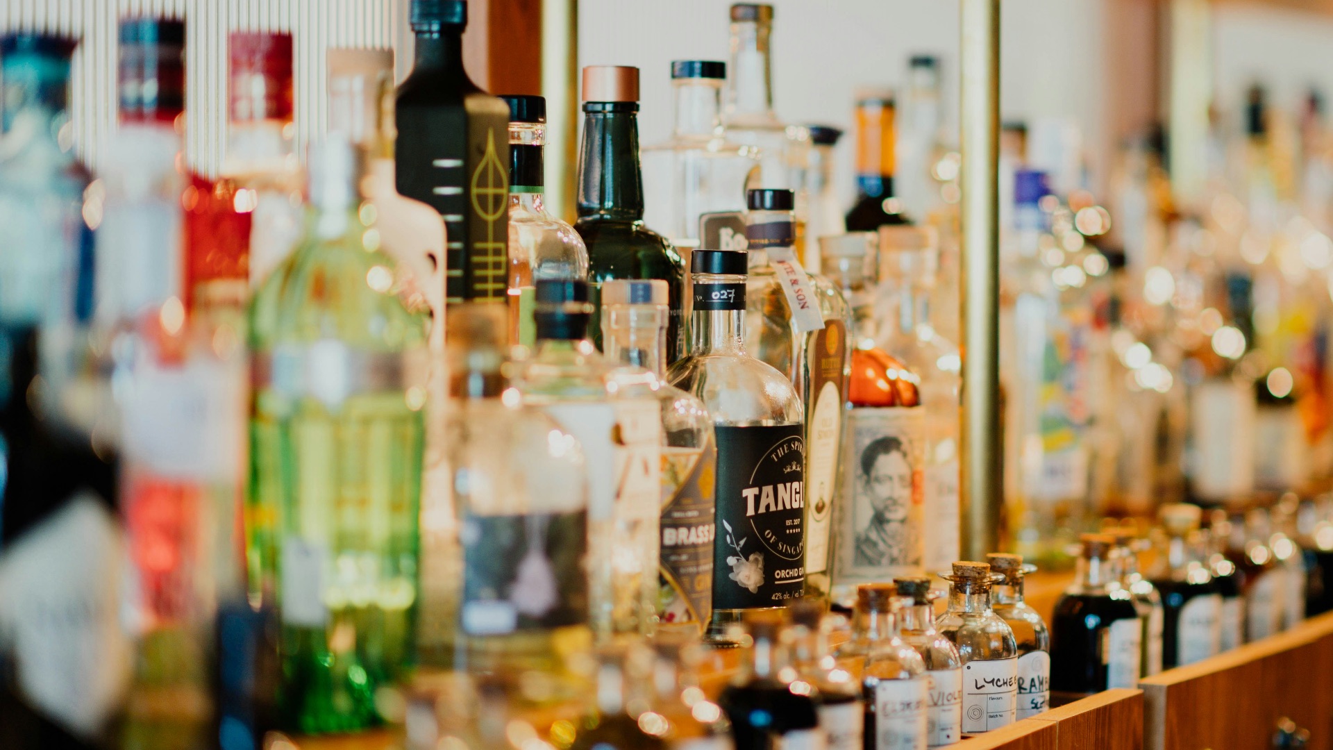 close-up photo of liquor bottles in rack