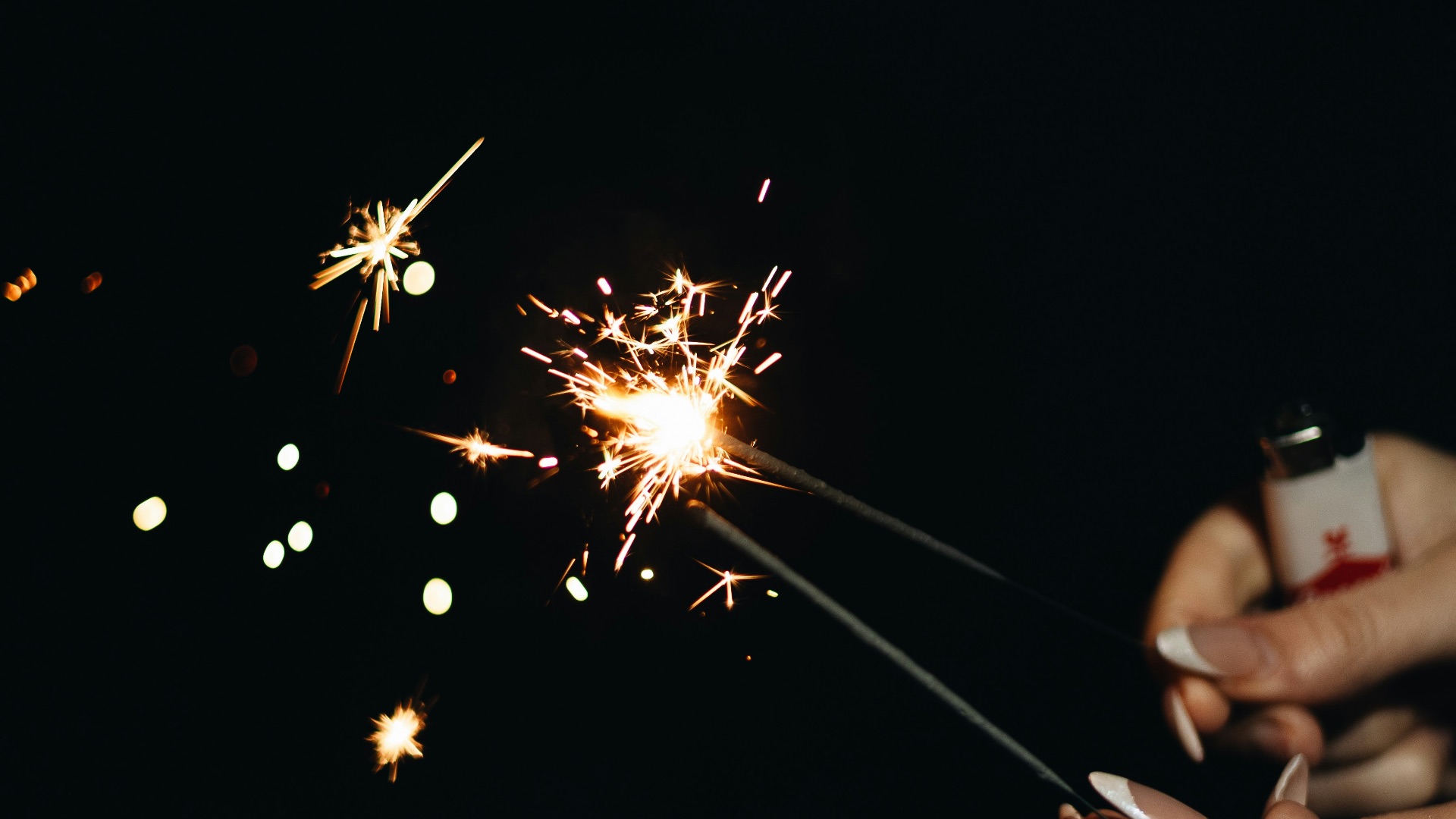 a person holding a sparkler in their hand