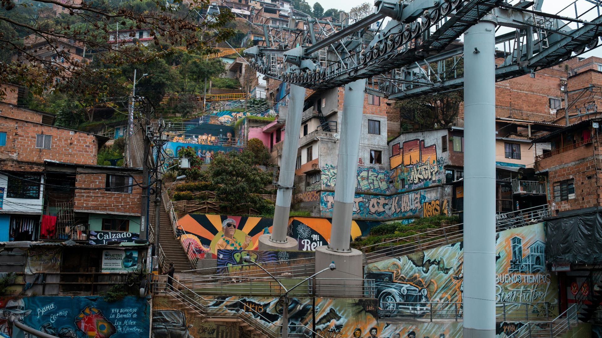 a bunch of graffiti on the side of a building