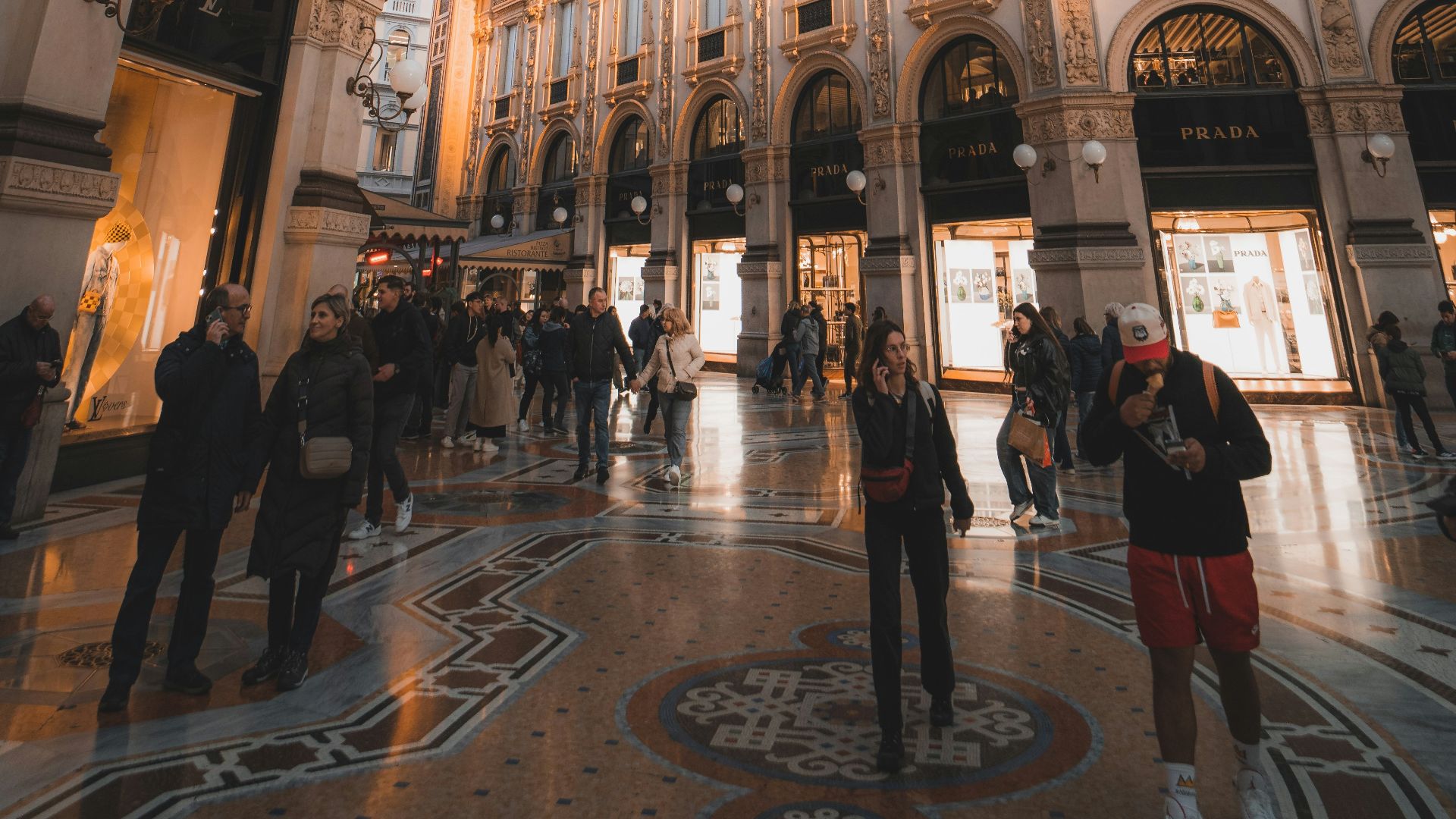 a group of people standing inside of a building
