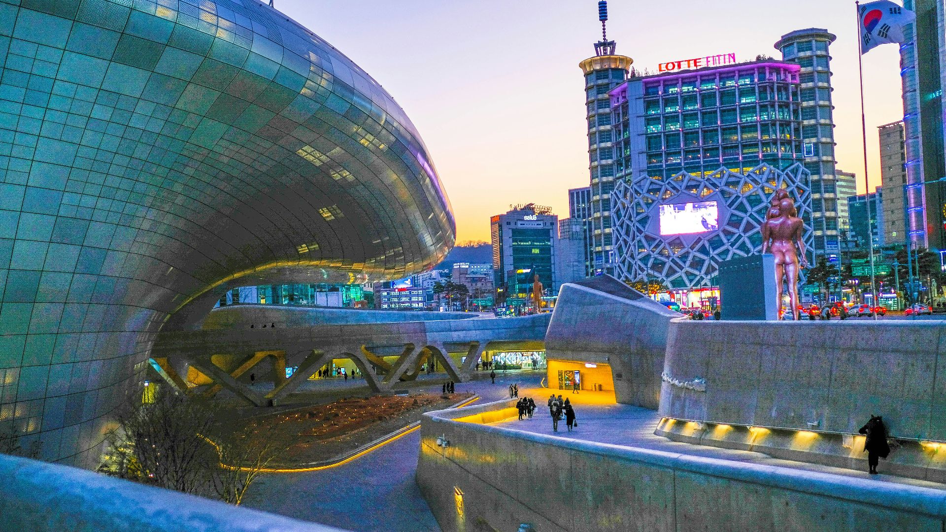 people walking on road beside building