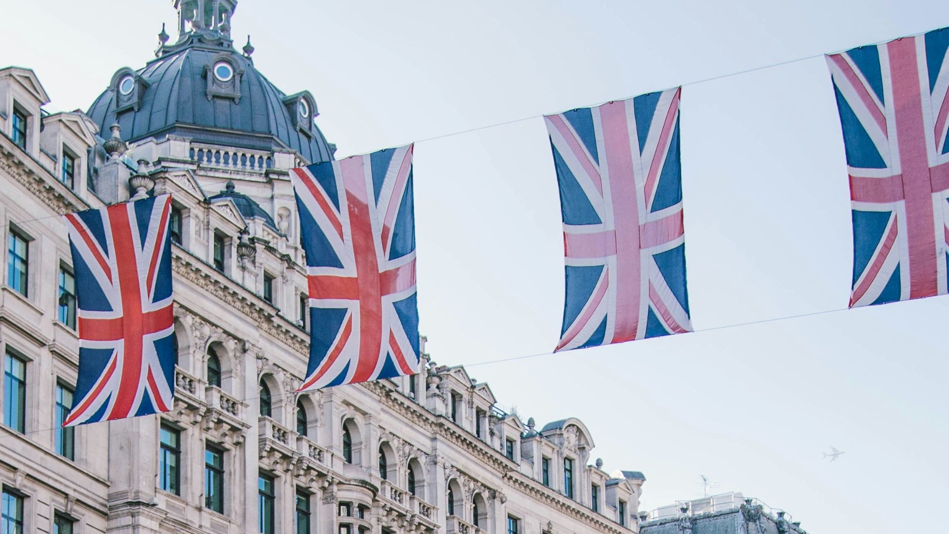 photo of car and bus near castle