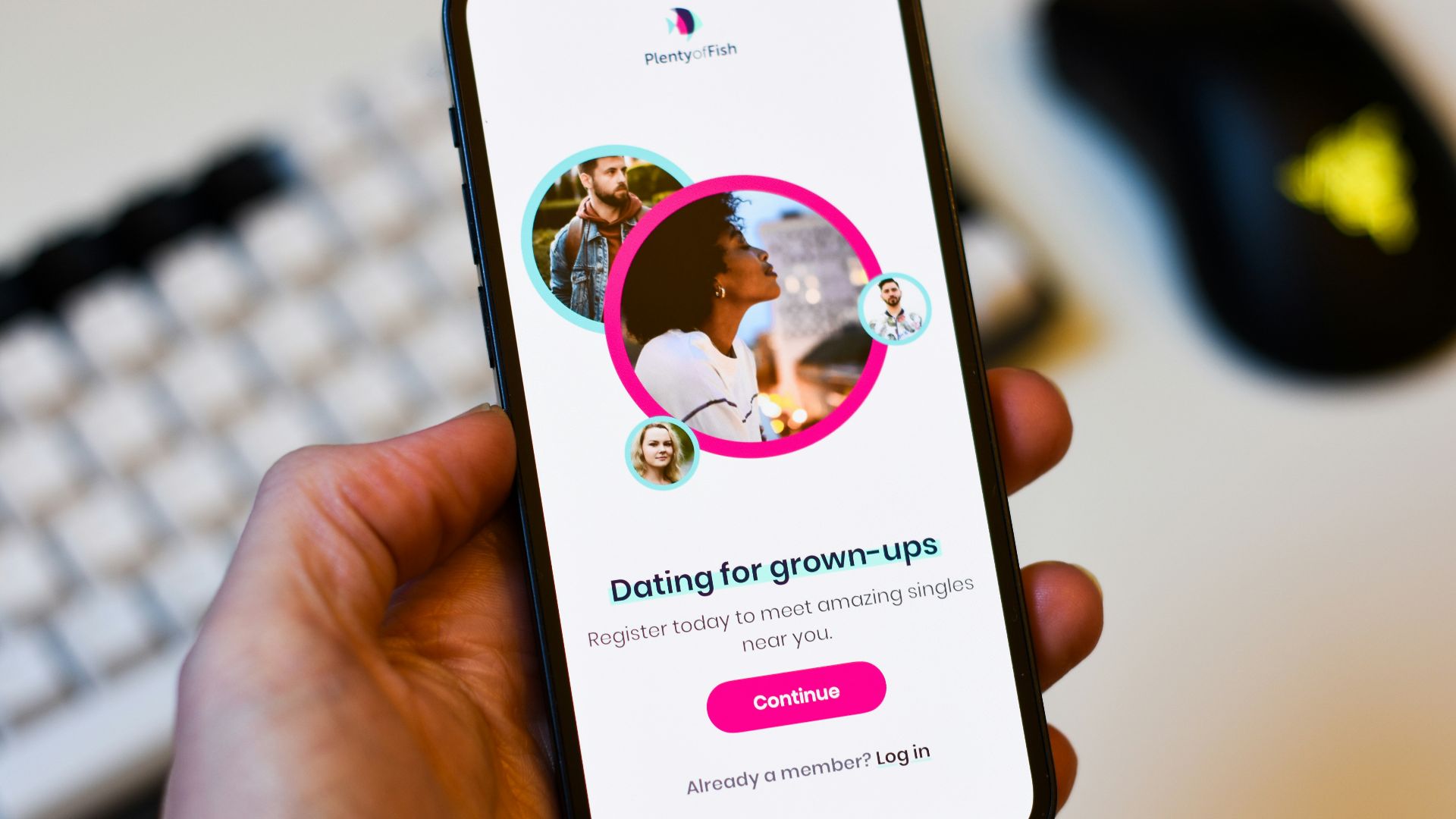 a person holding a cell phone in their hand