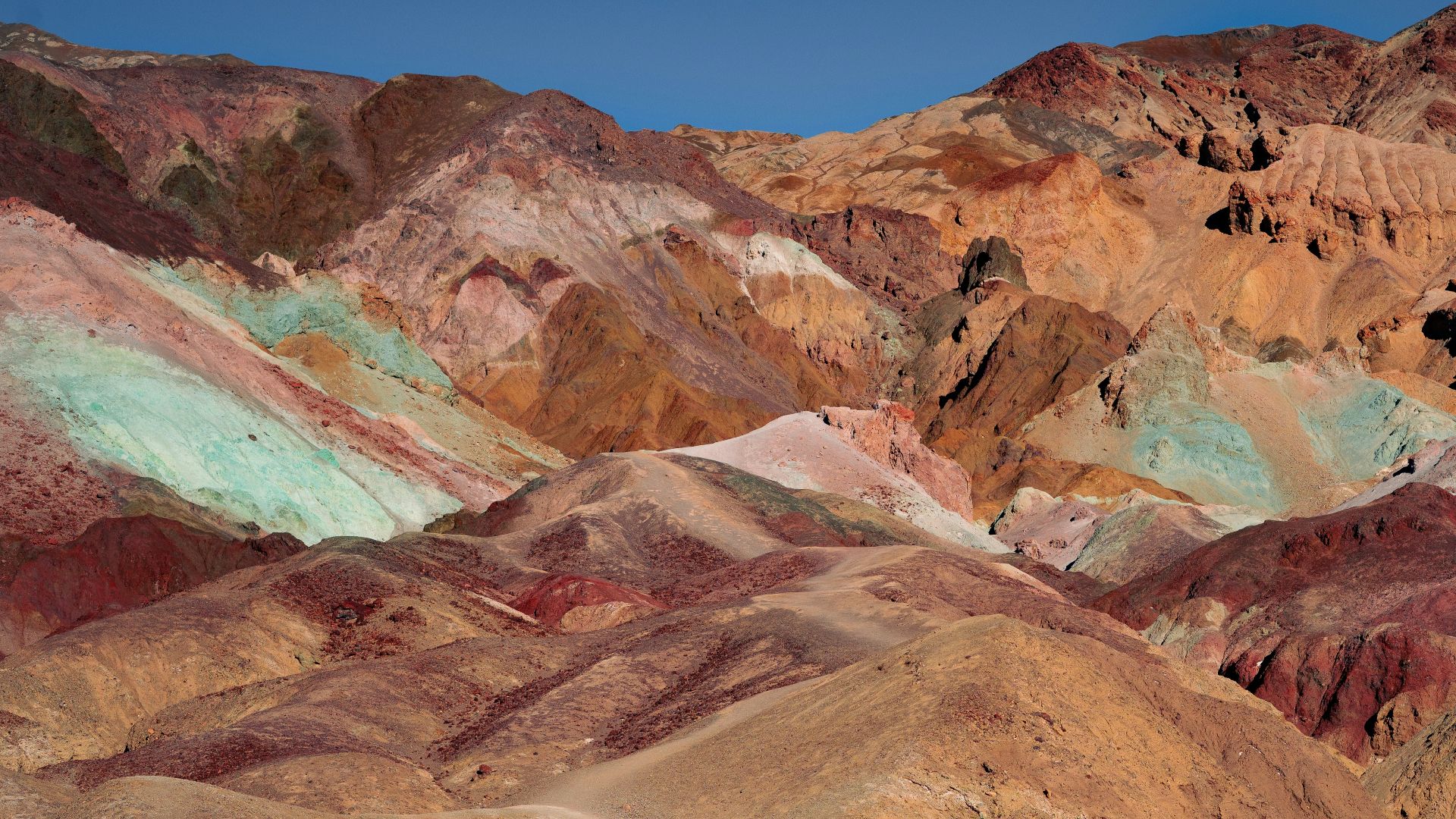 brown and gray mountains under blue sky during daytime