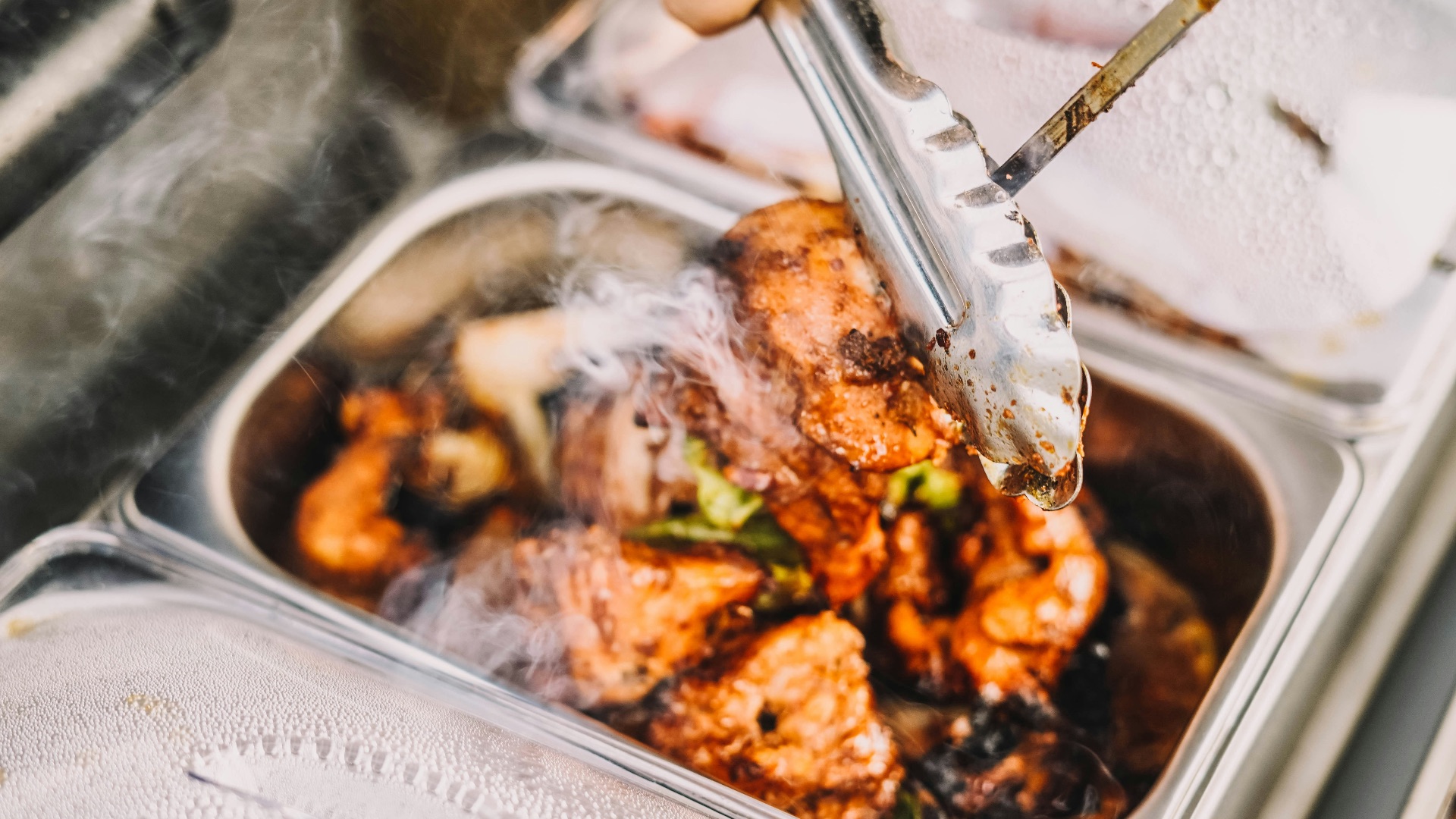 person holding stainless steel fork and knife