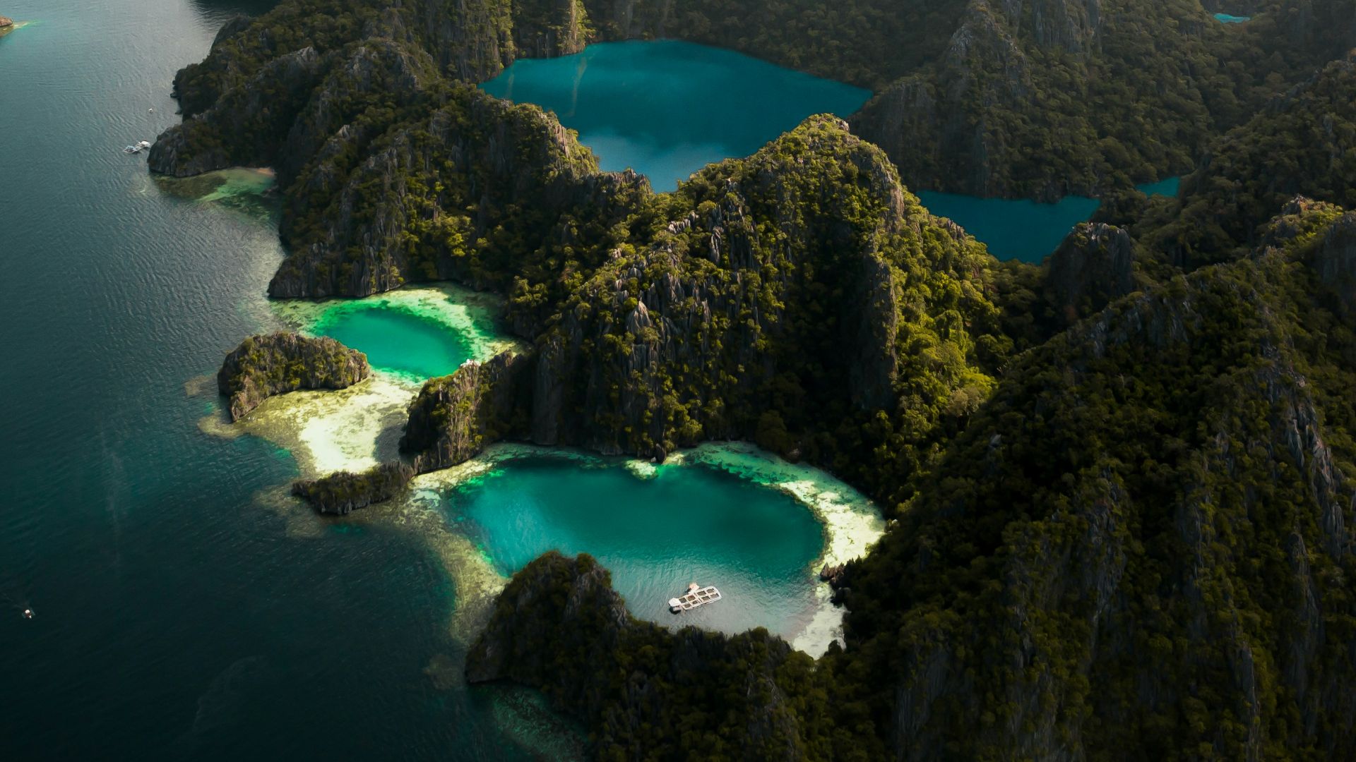aerial view of blue lake surrounded by mountains during daytime