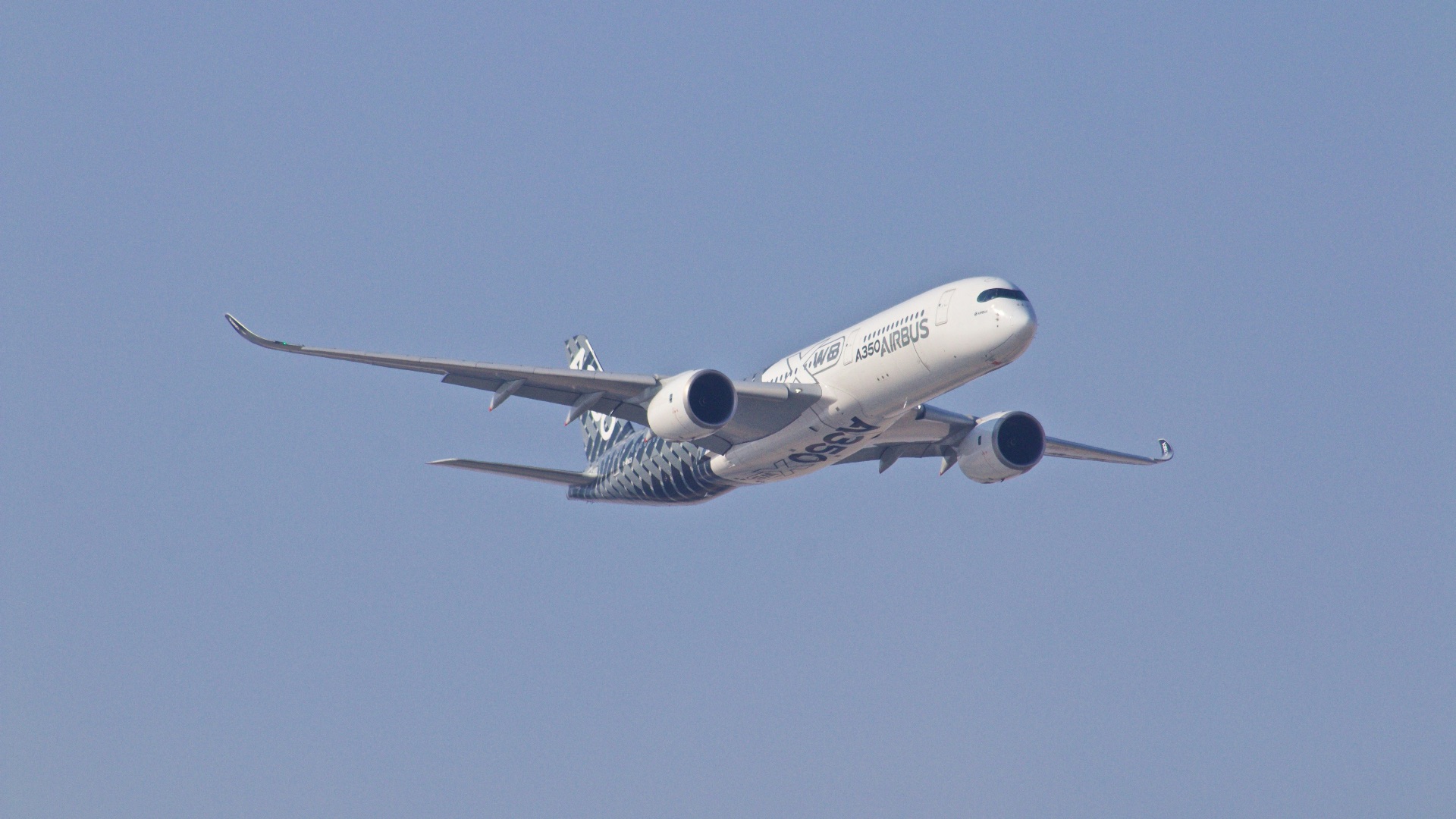 white airplane taking off during daytime
