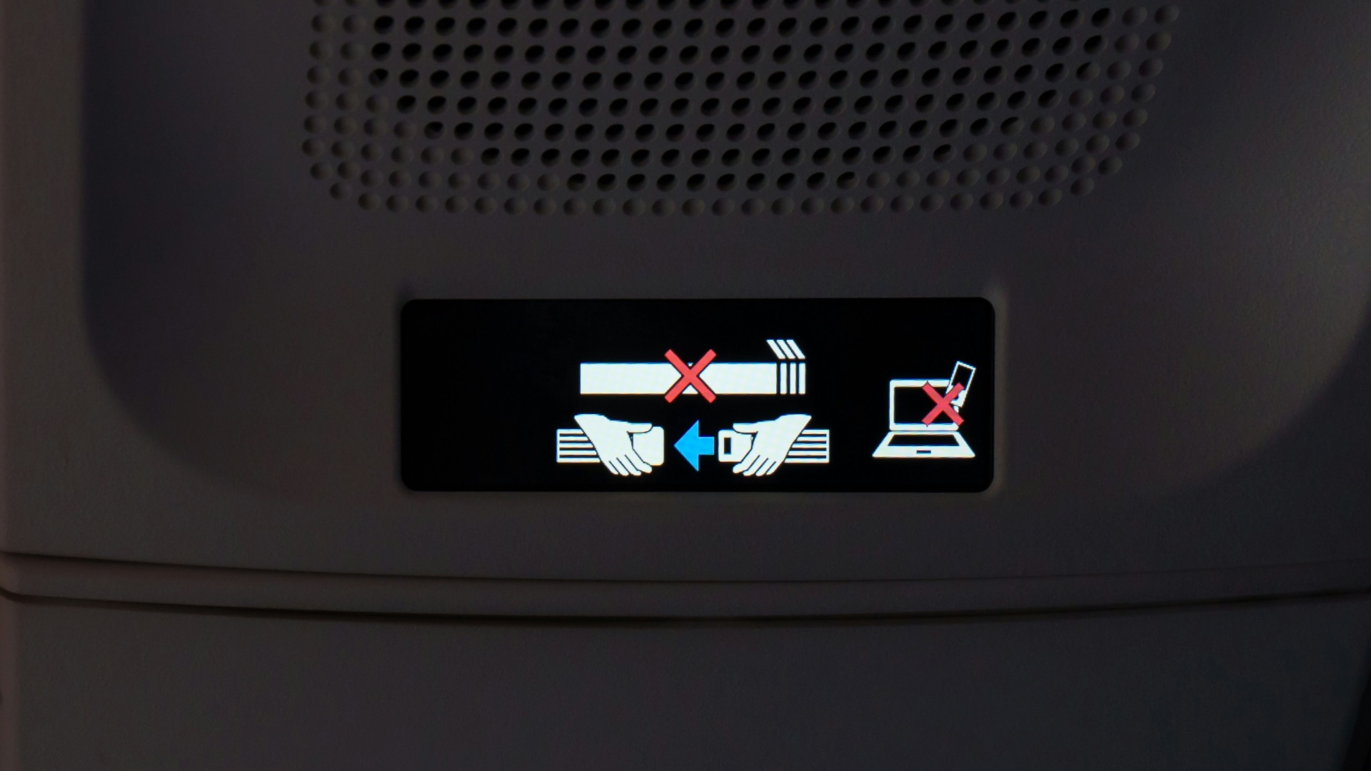 Airplane cabin ceiling with illuminated lights