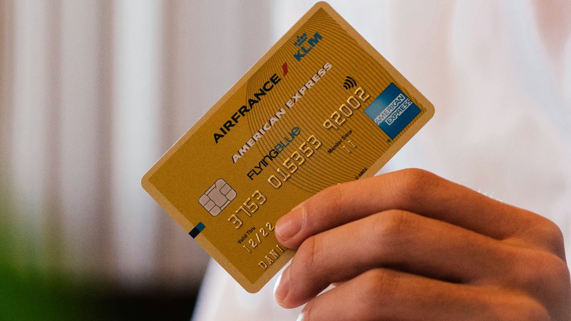 person holding credit card