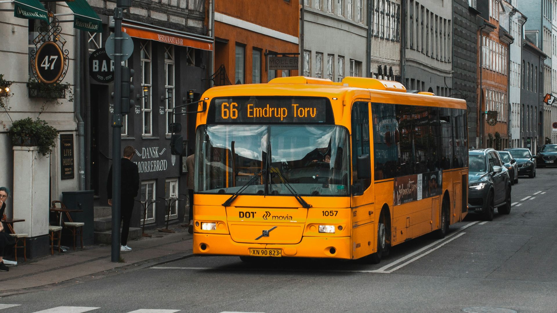 yellow and black bus on road at daytime
